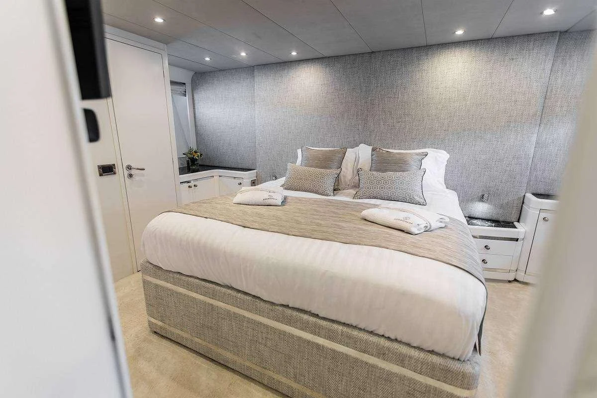 a bed in a room aboard ANDROMEDA Yacht for Charter