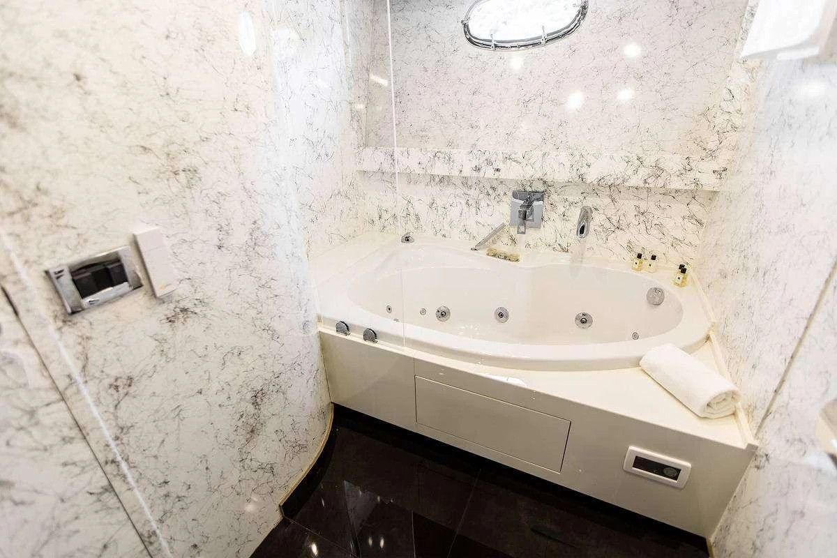 a bathroom with a sink and a mirror aboard ANDROMEDA Yacht for Charter