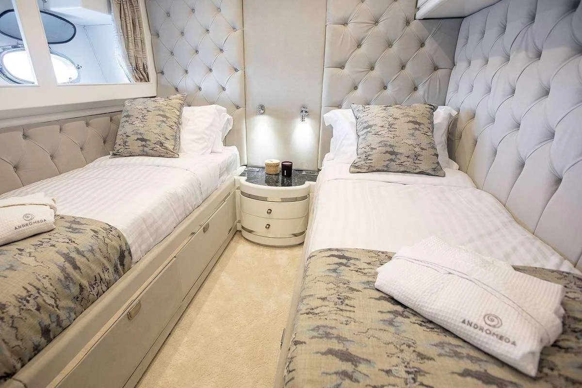 a room with two beds aboard ANDROMEDA Yacht for Charter
