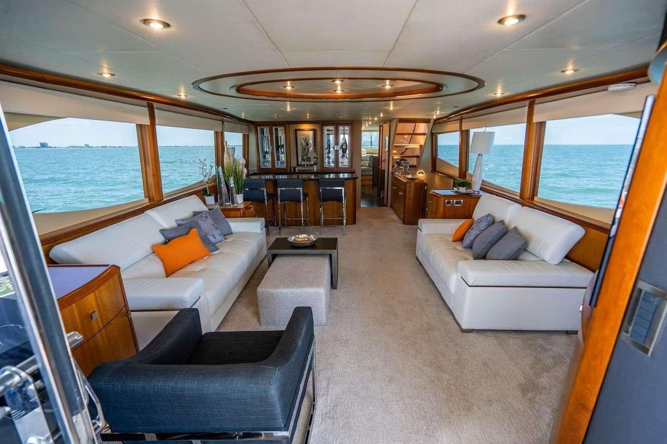 a living room with a couch and a table aboard VOYAGER Yacht for Charter