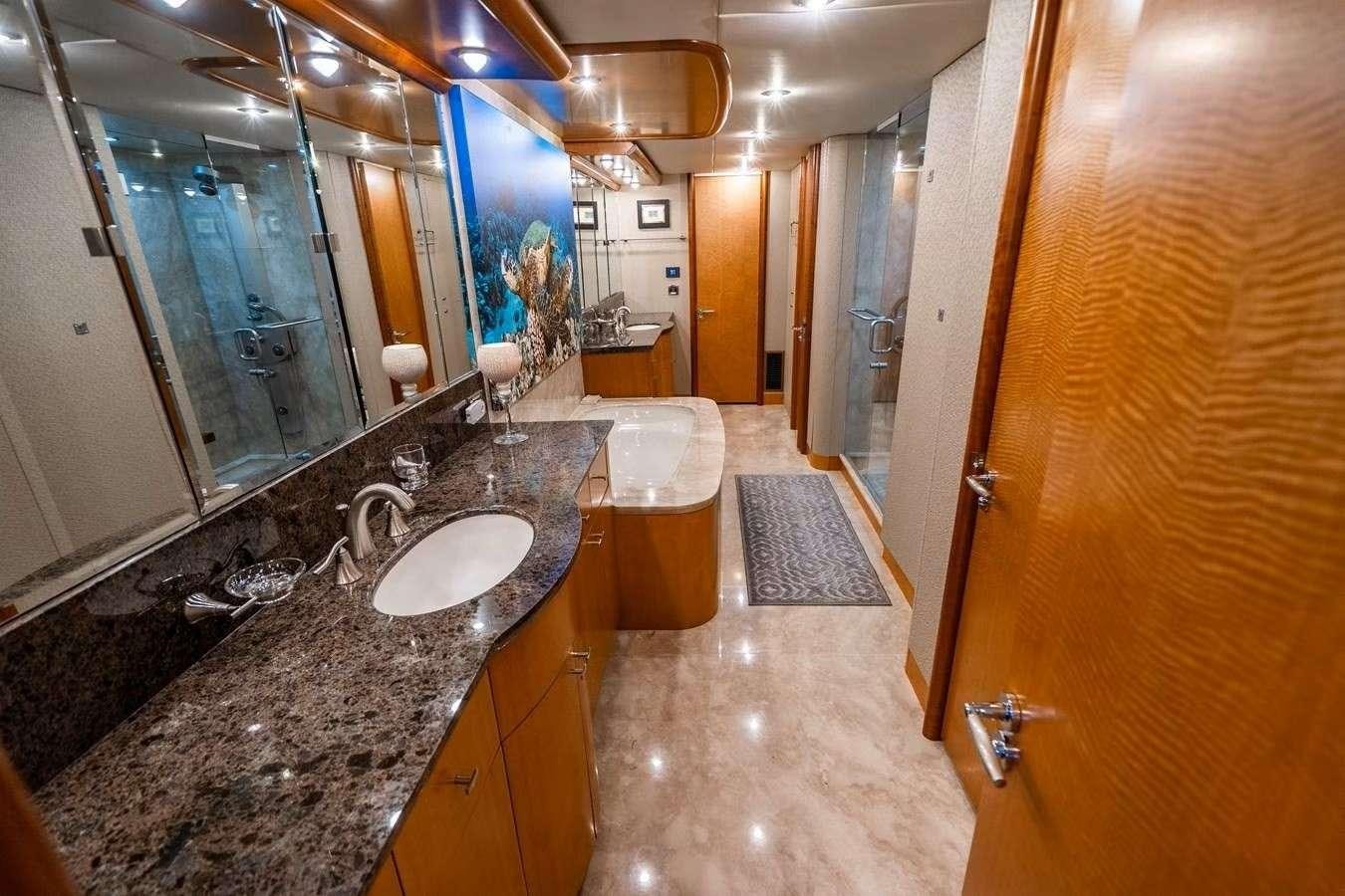 a bathroom with marble counter tops aboard VOYAGER Yacht for Charter