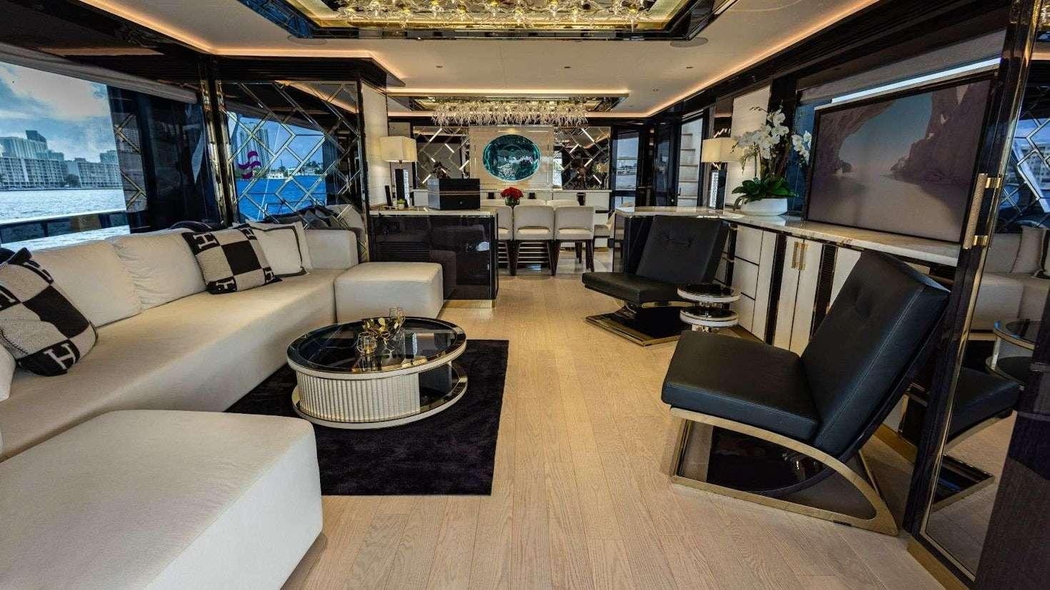 a living room with a large window aboard OLYMPUS Yacht for Charter