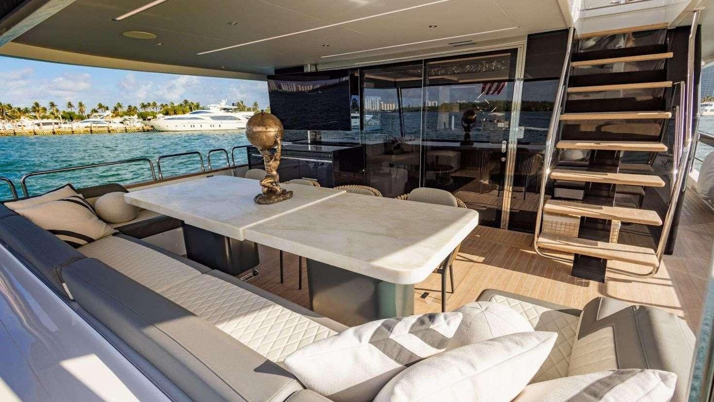 a room with a table and a statue aboard OLYMPUS Yacht for Charter