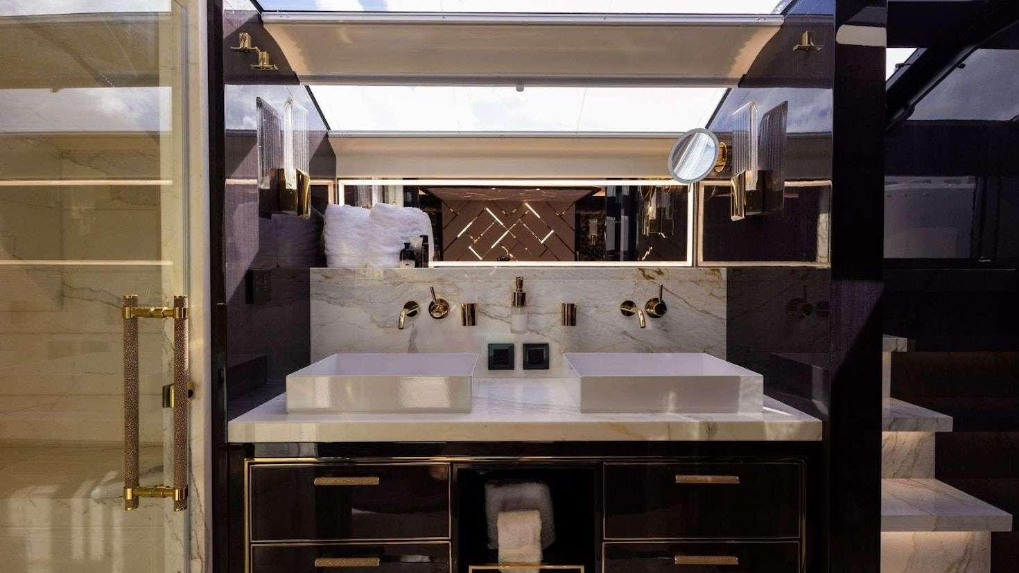 a bathroom with sinks and mirrors aboard OLYMPUS Yacht for Charter
