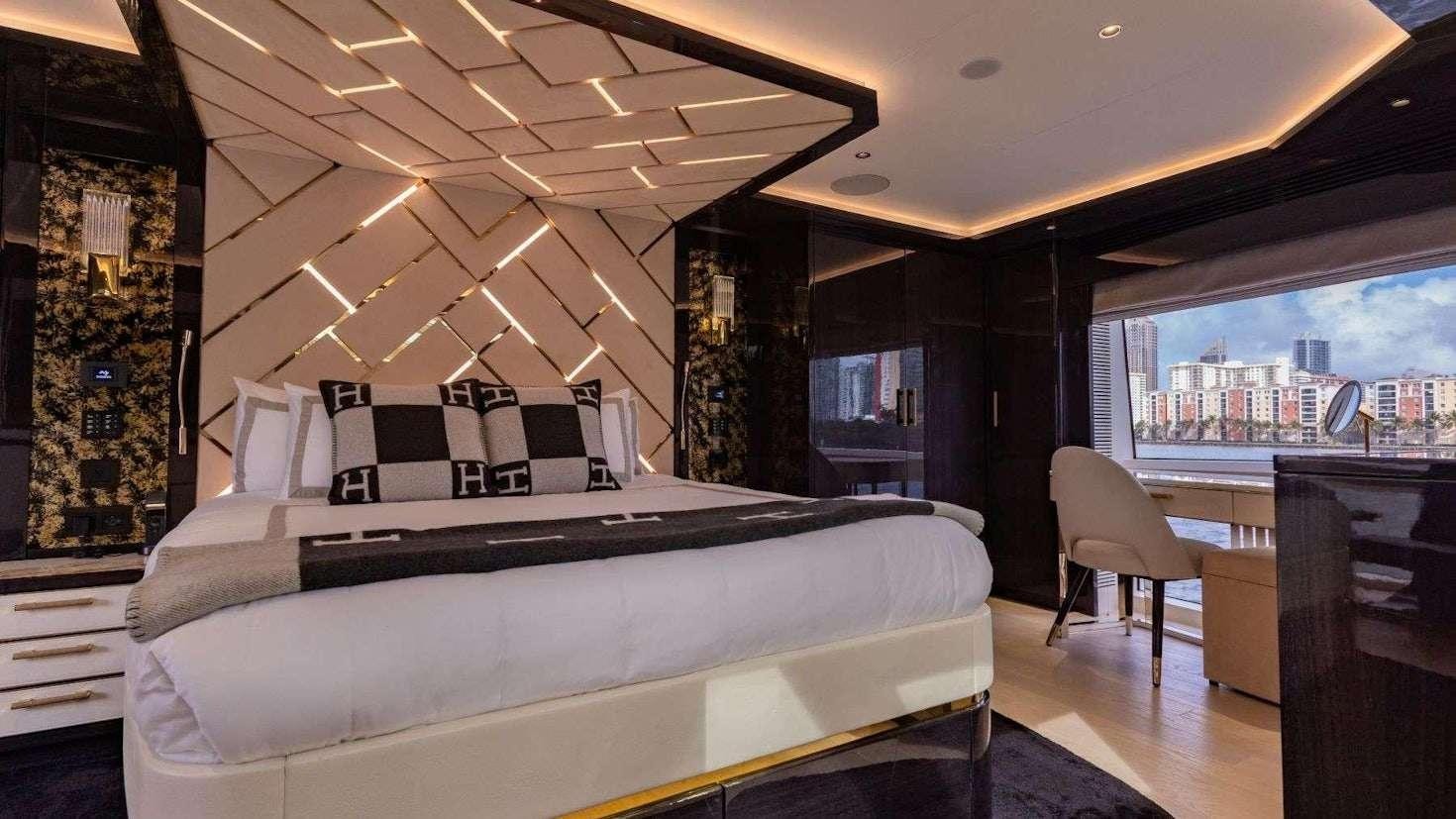 a bedroom with a large bed aboard OLYMPUS Yacht for Charter