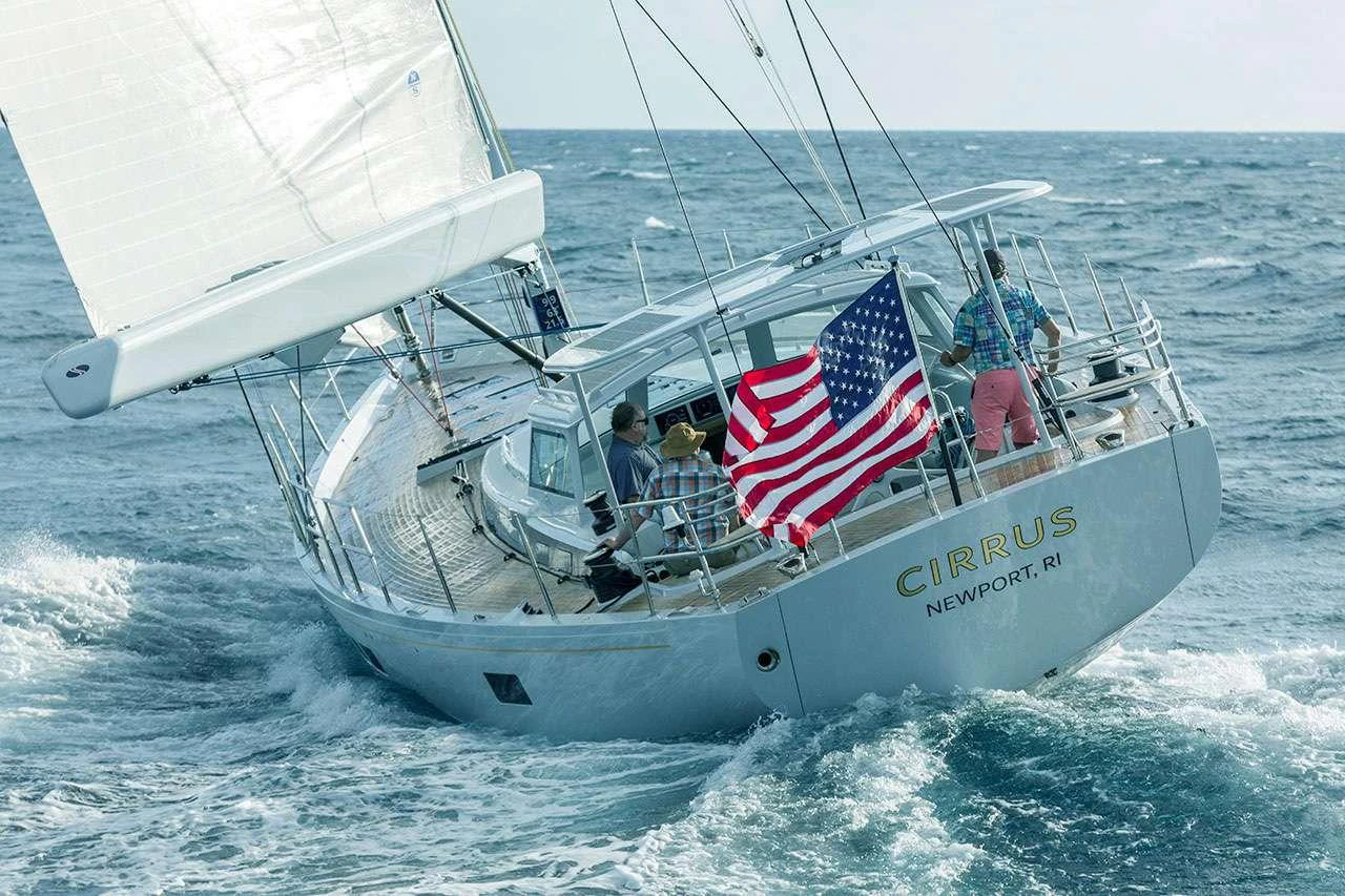 a boat with a flag on it aboard CIRRUS Yacht for Charter
