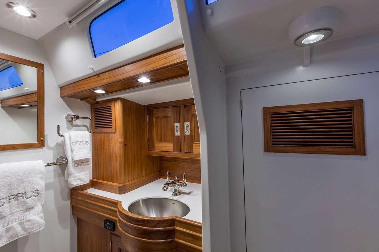 a bathroom with a sink and a mirror aboard CIRRUS Yacht for Charter