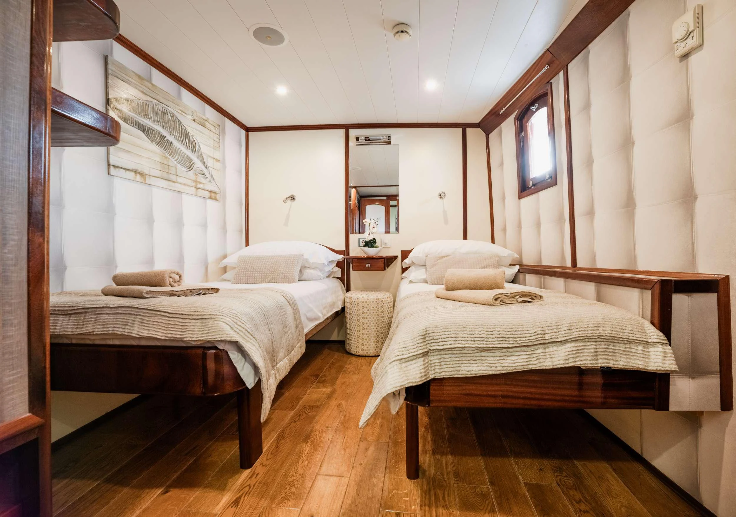 a couple of beds in a room aboard MENDULA Yacht for Charter