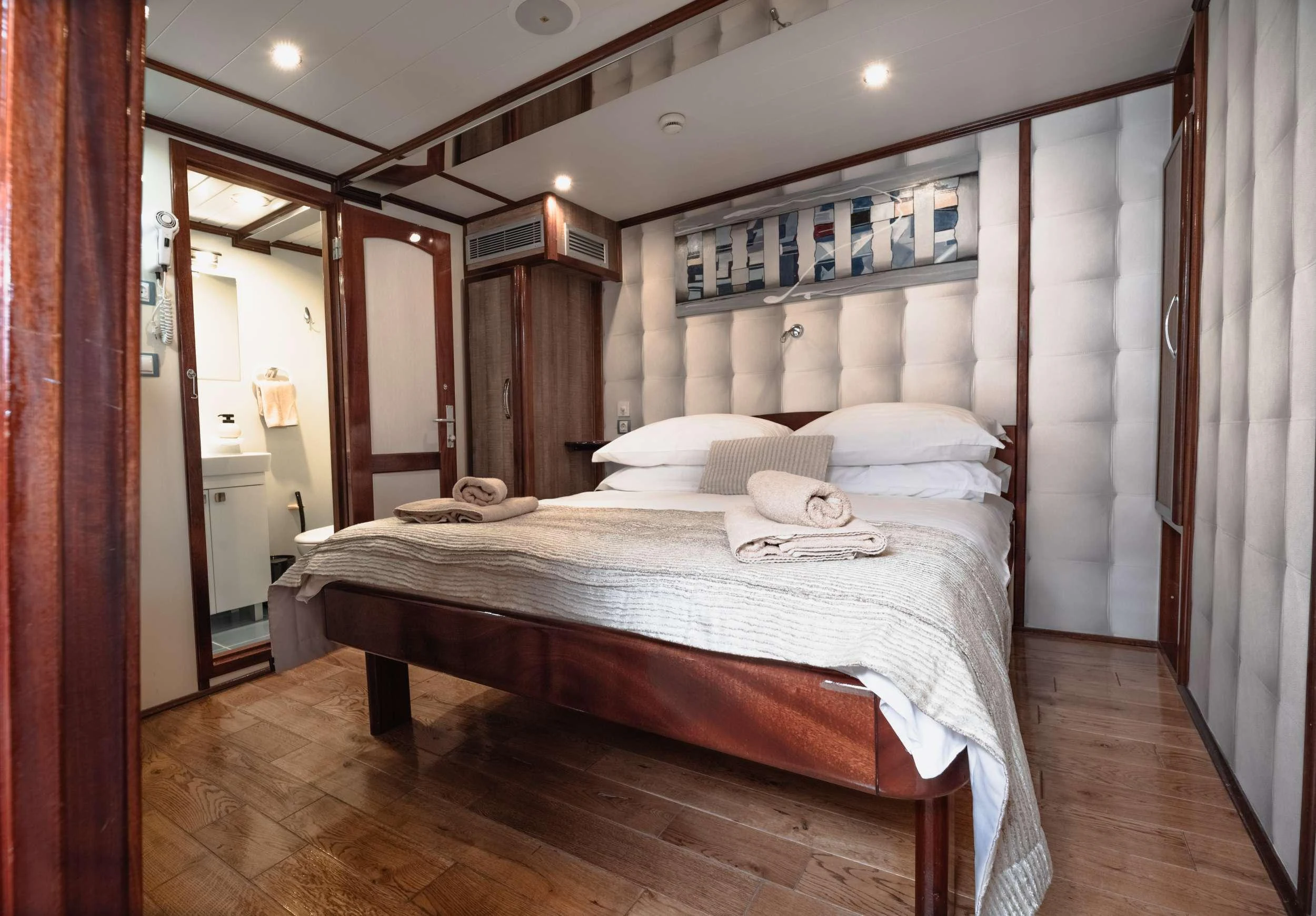 a bed in a room aboard MENDULA Yacht for Charter