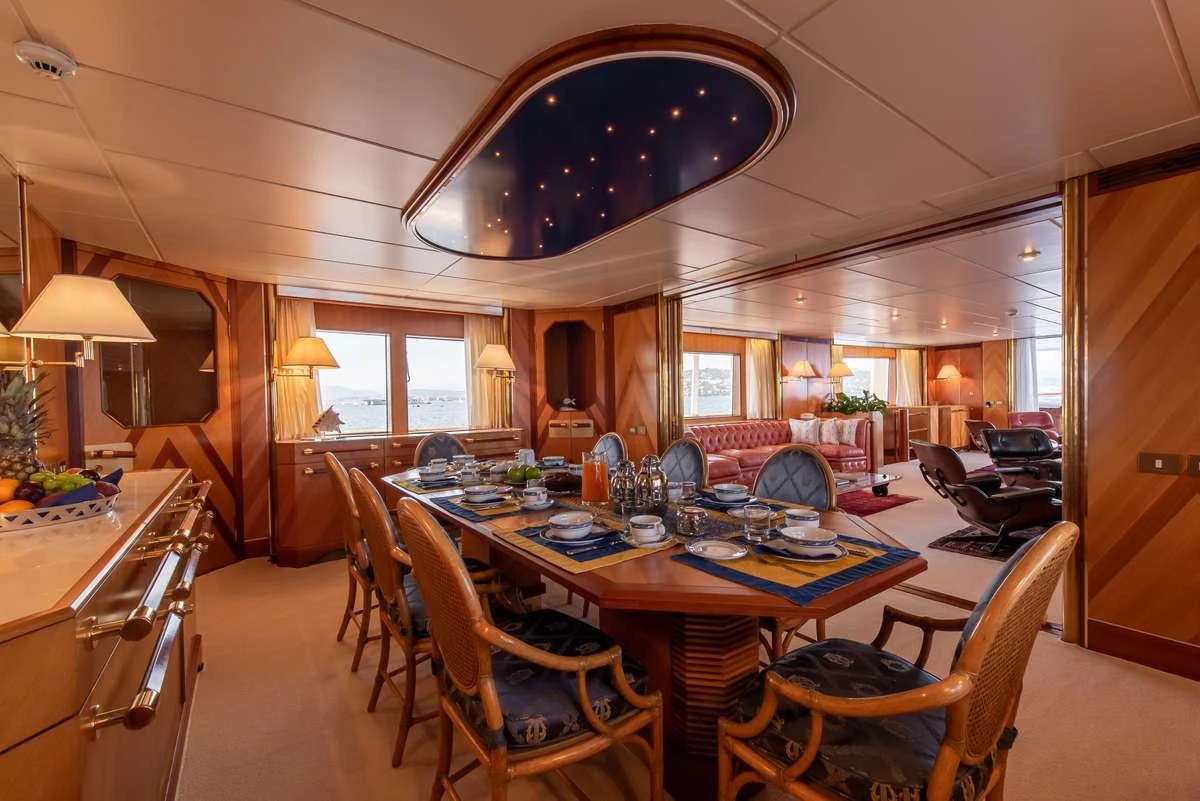 a large kitchen with dining tables aboard SHEERGOLD Yacht for Charter