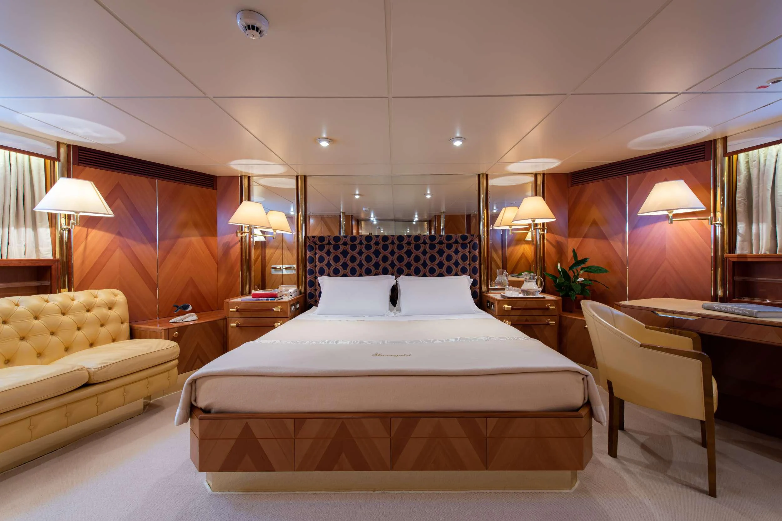 a hotel room with two beds aboard SHEERGOLD Yacht for Charter