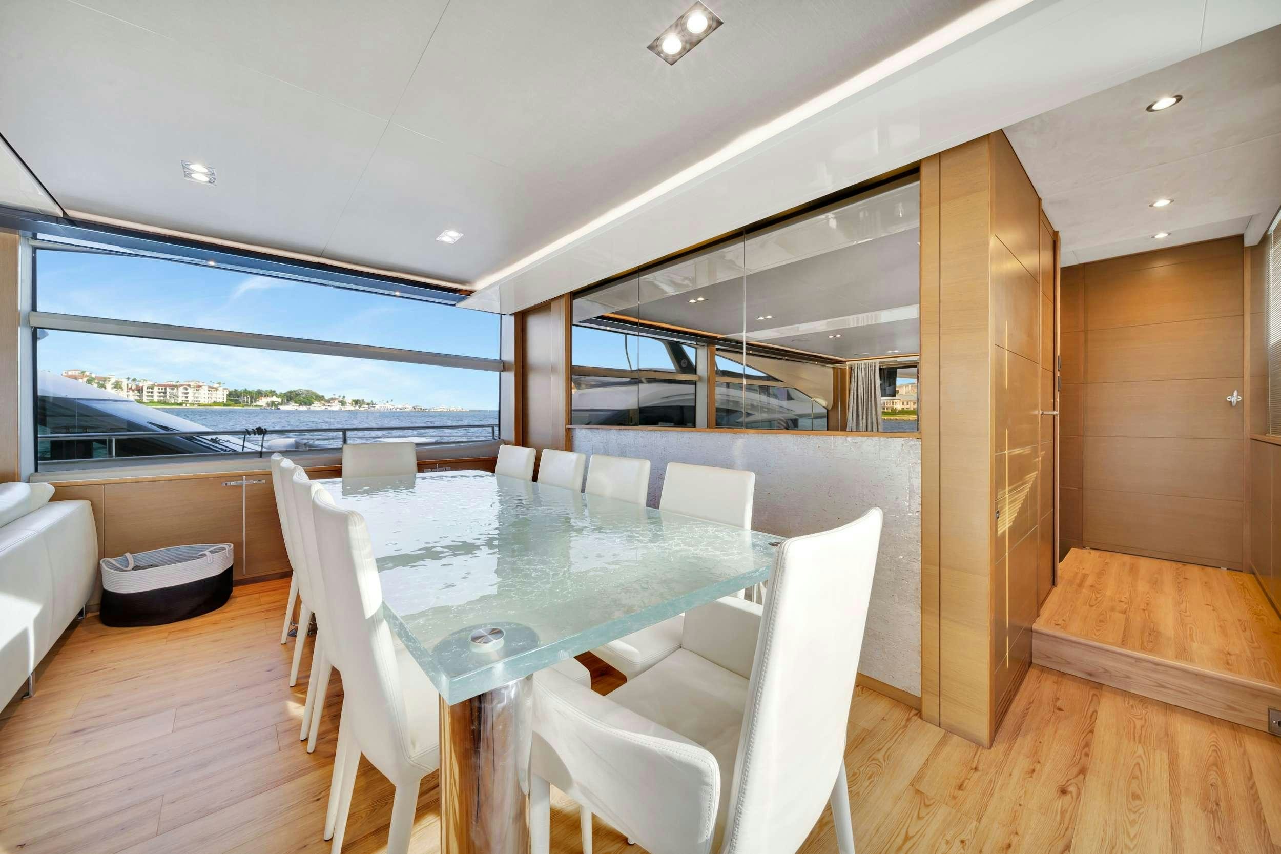 a room with a table and chairs aboard FREEDOM Yacht for Charter