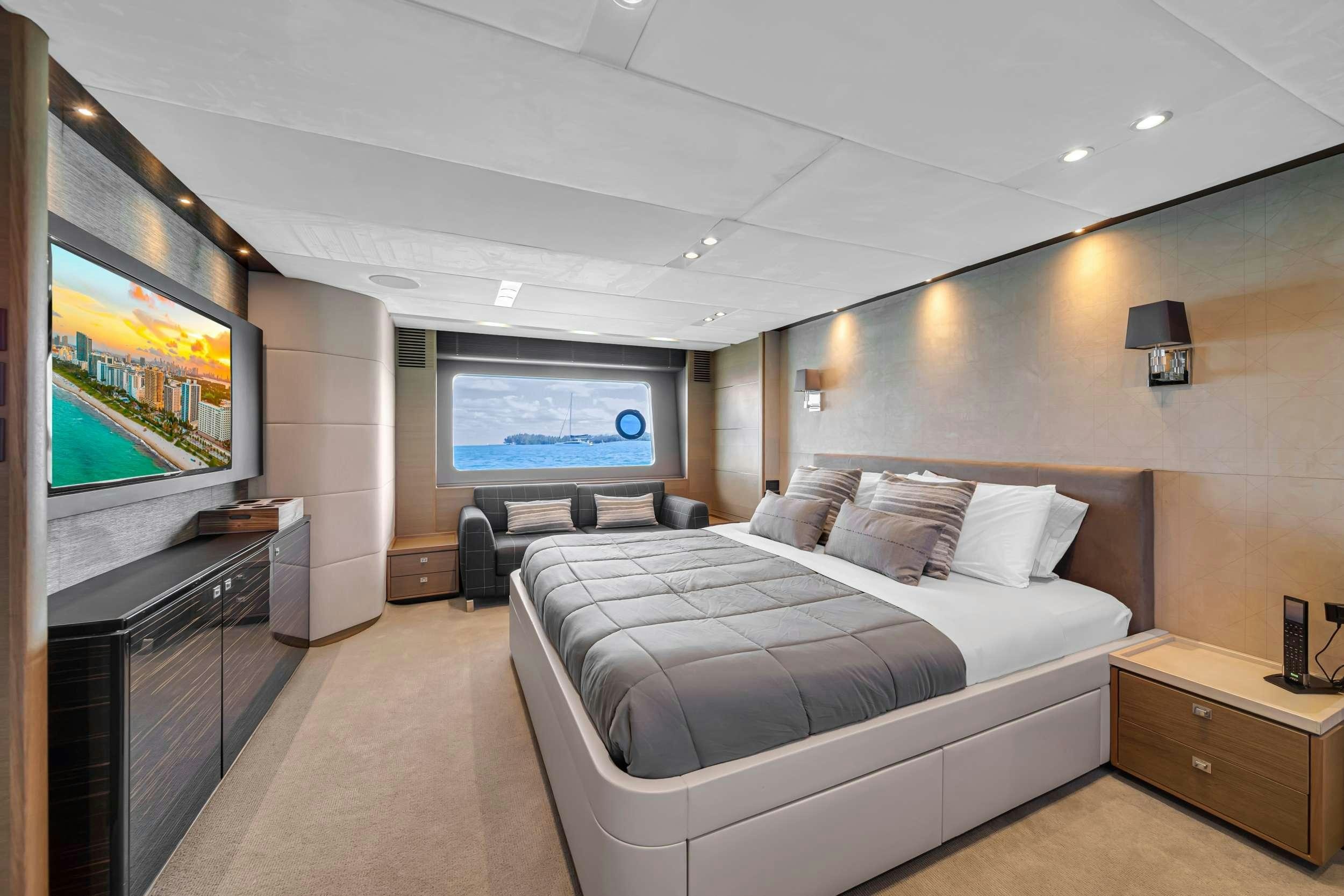 a bedroom with a large bed aboard FREEDOM Yacht for Charter