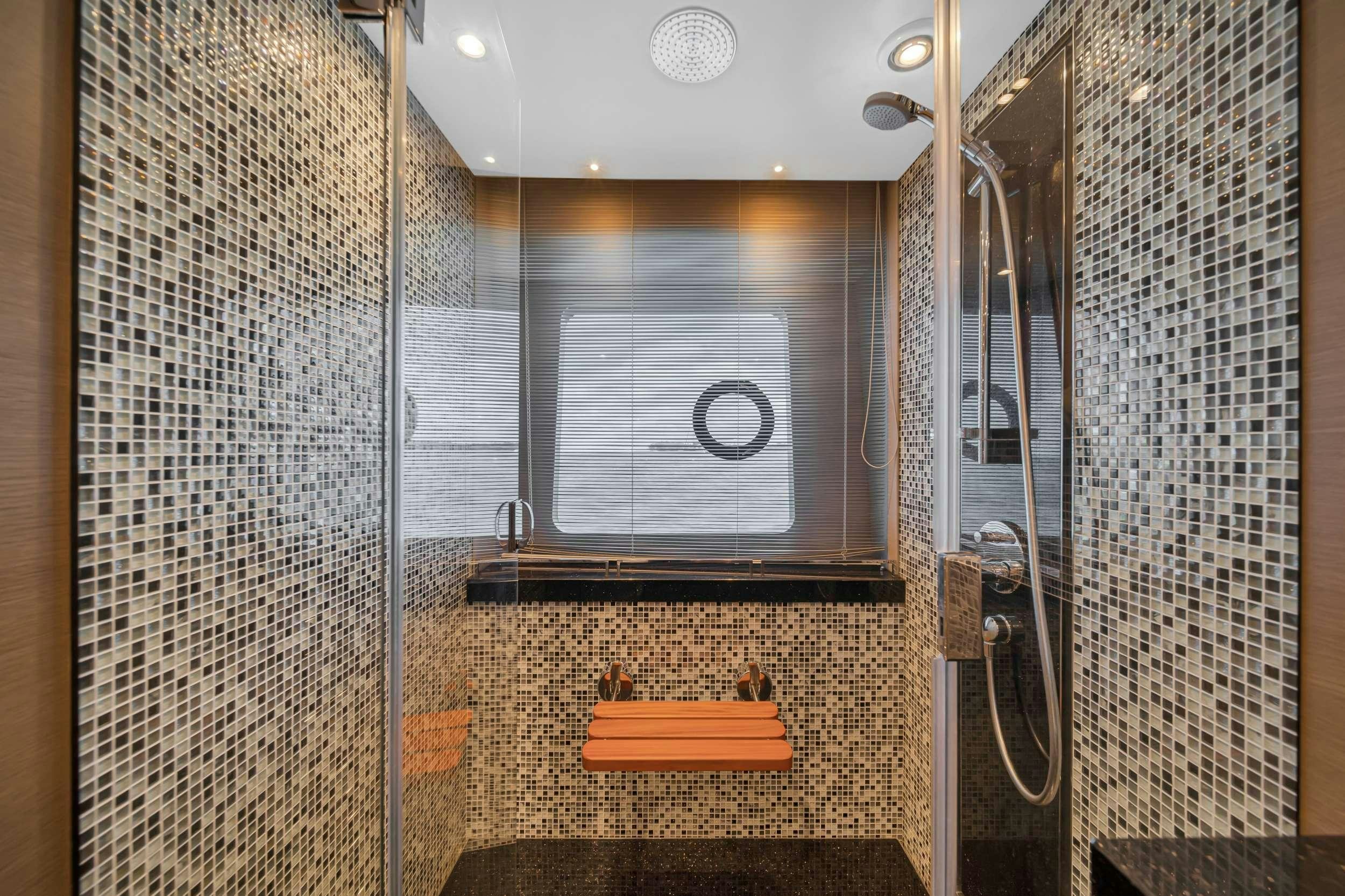 a bathroom with a shower unit aboard FREEDOM Yacht for Charter