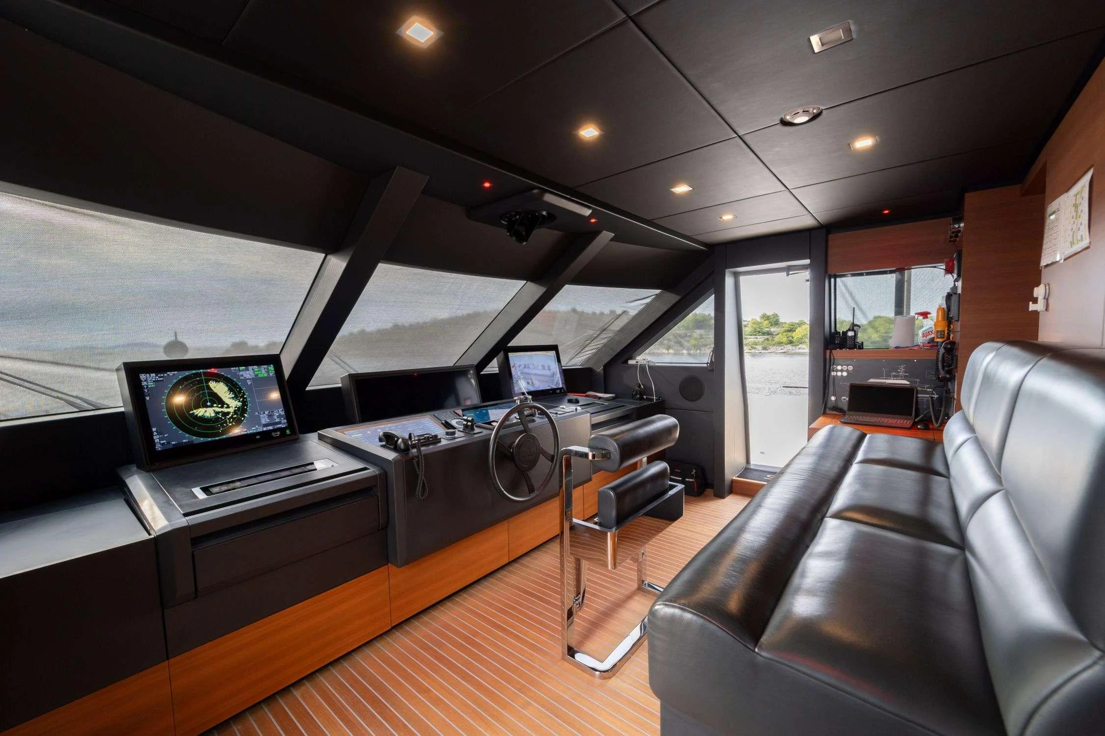 a room with a table and chairs aboard SK Yacht for Charter