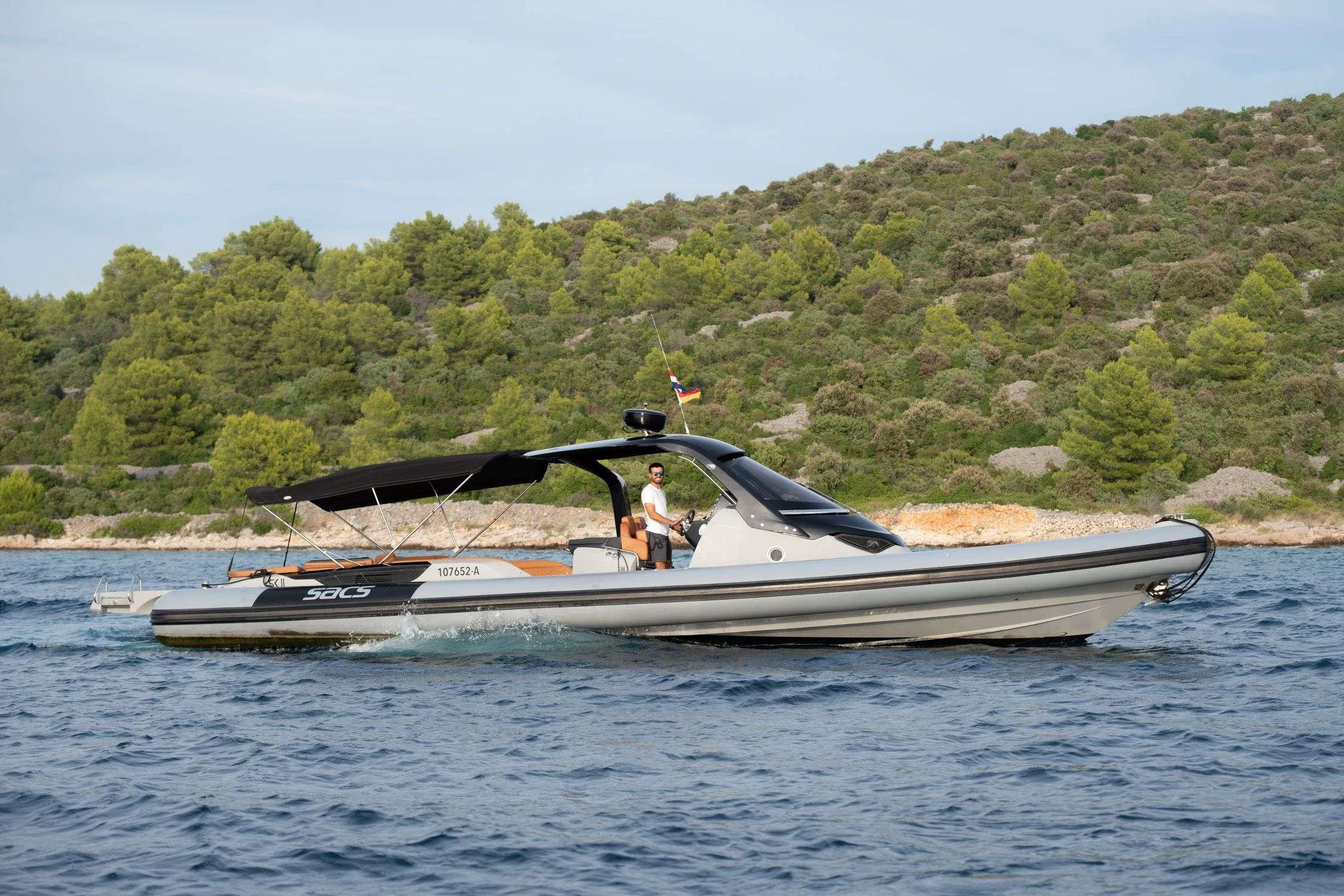 a person driving a boat aboard SK Yacht for Charter
