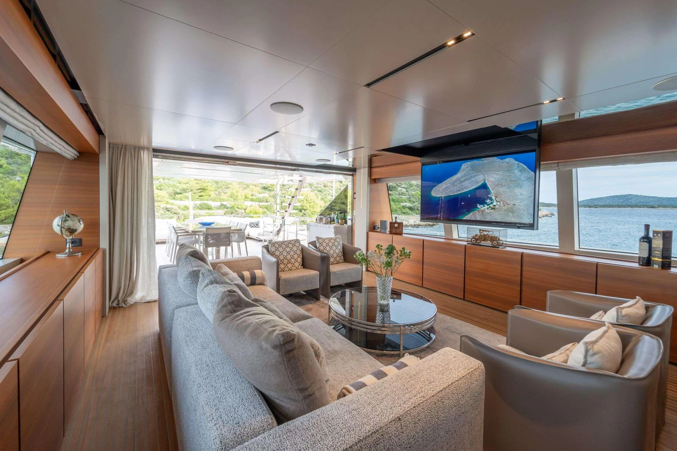 a living room with a large window aboard SK Yacht for Charter