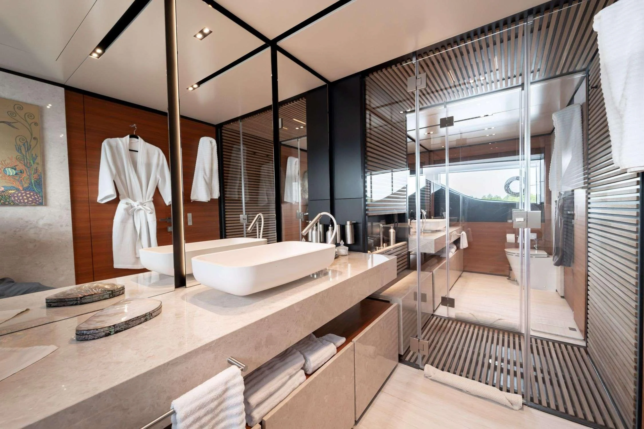 a bathroom with a large mirror aboard SK Yacht for Charter
