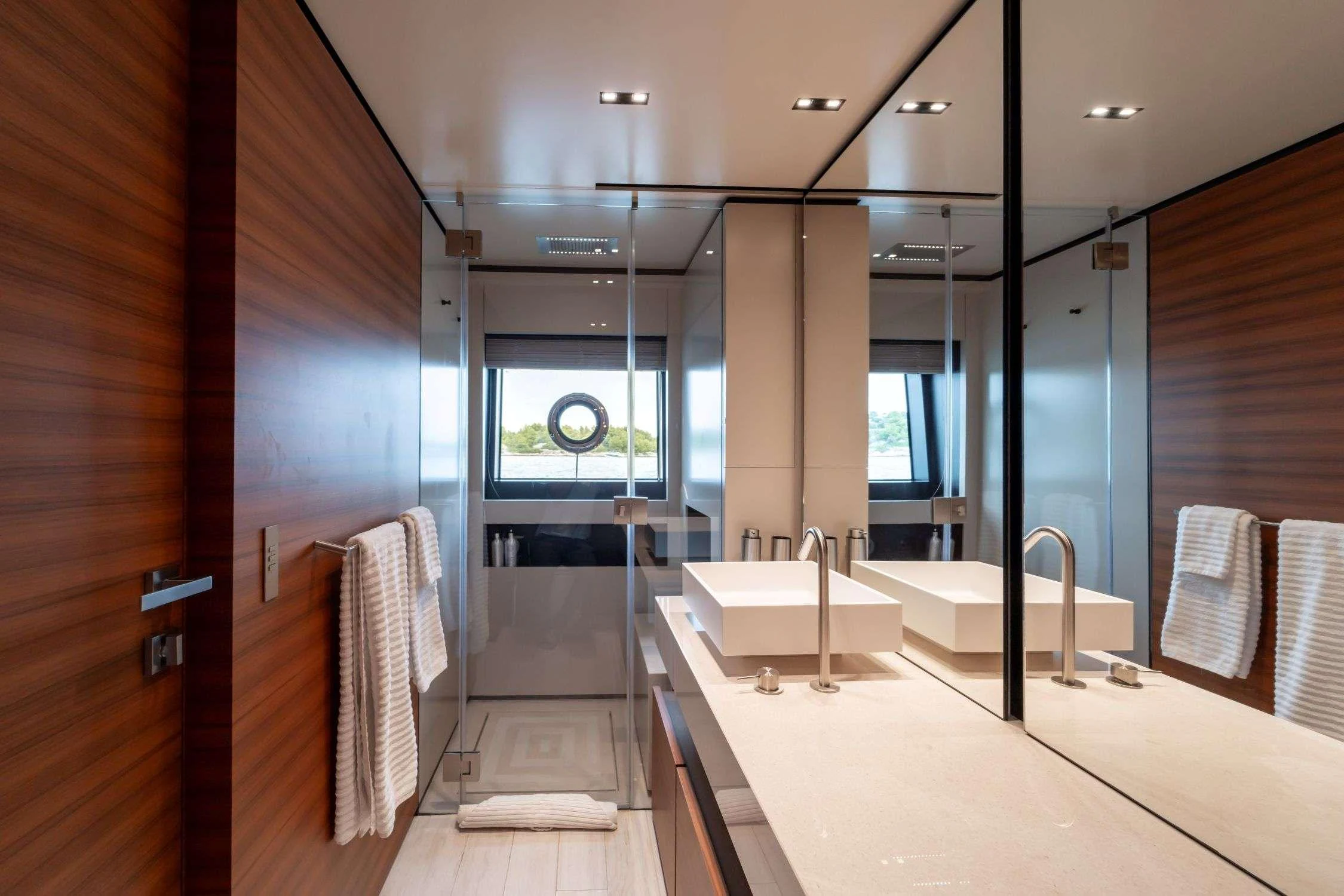 a bathroom with a tub and a sink aboard SK Yacht for Charter