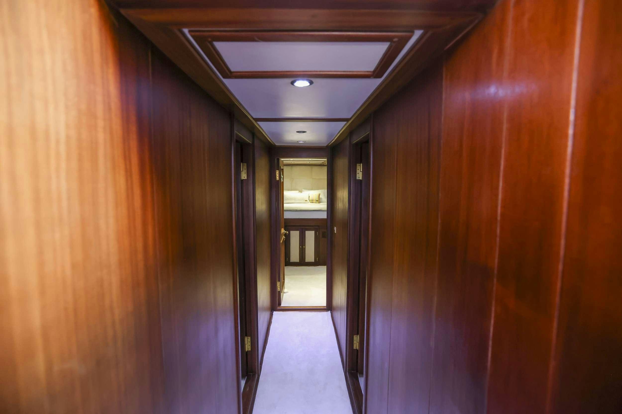 a hallway with a door aboard GAZELLA Yacht for Charter