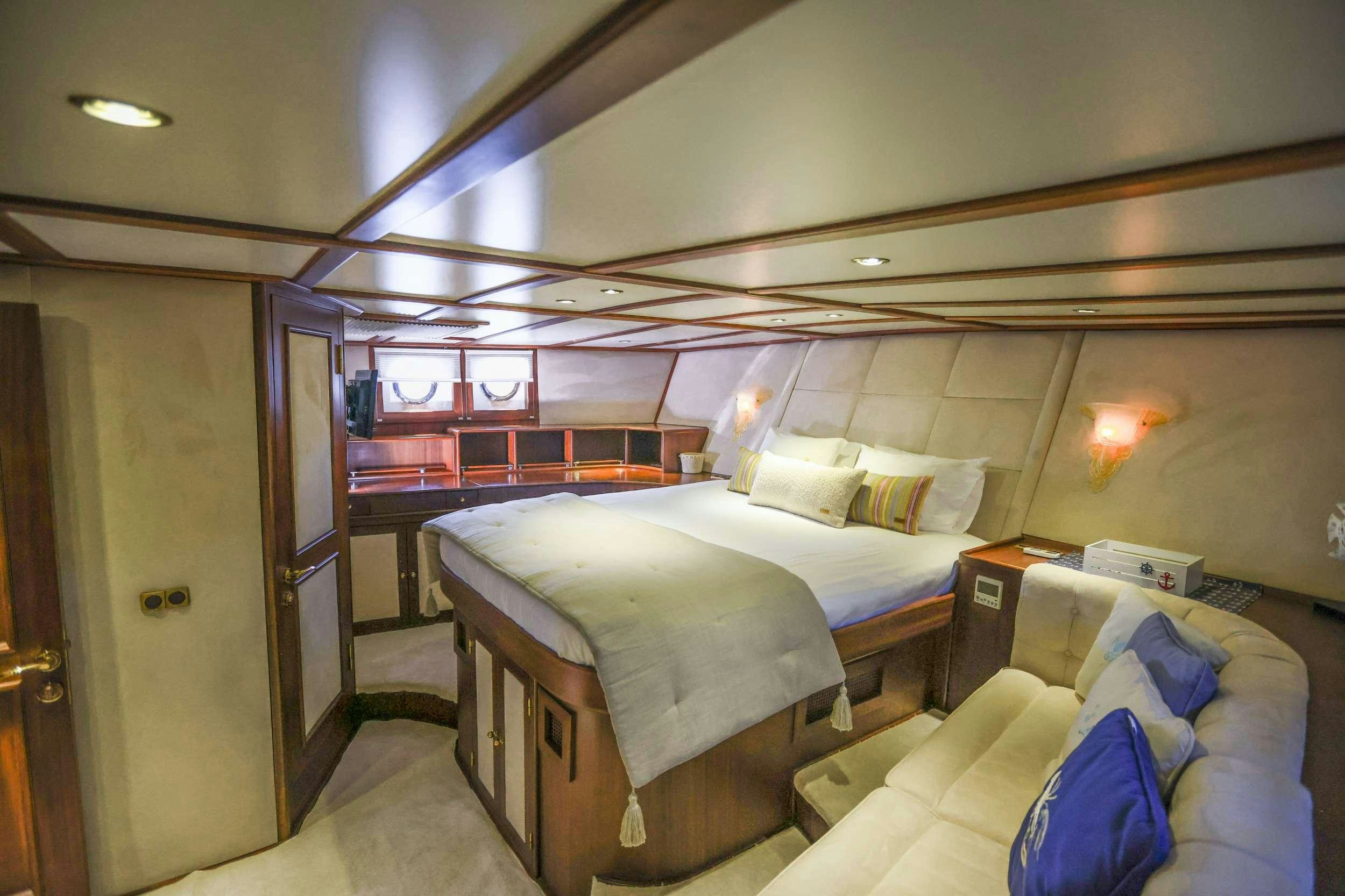 a room with two beds aboard GAZELLA Yacht for Charter