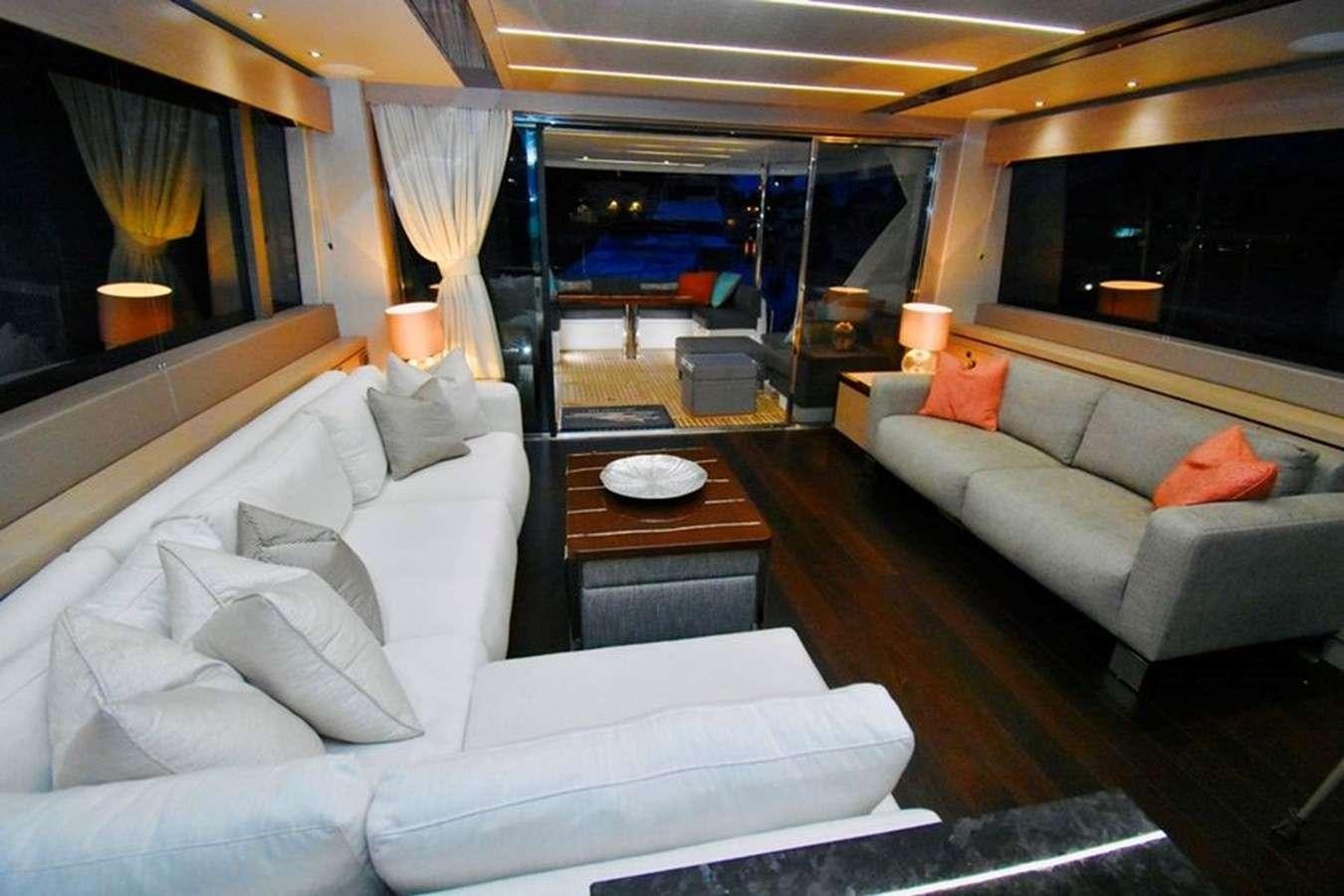 a living room with a couch and a coffee table aboard DO  ANYWAY Yacht for Charter