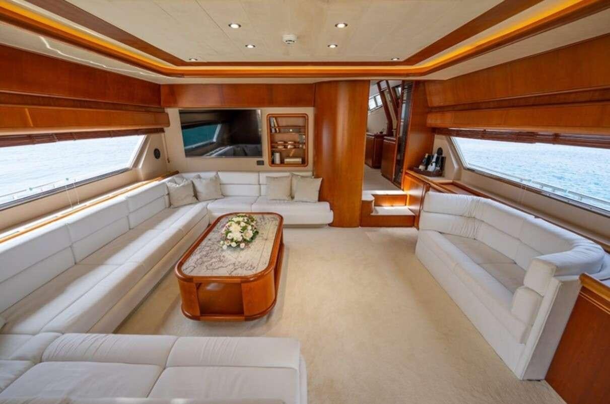 a room with a couch and a table aboard BELLAS BOY Yacht for Charter