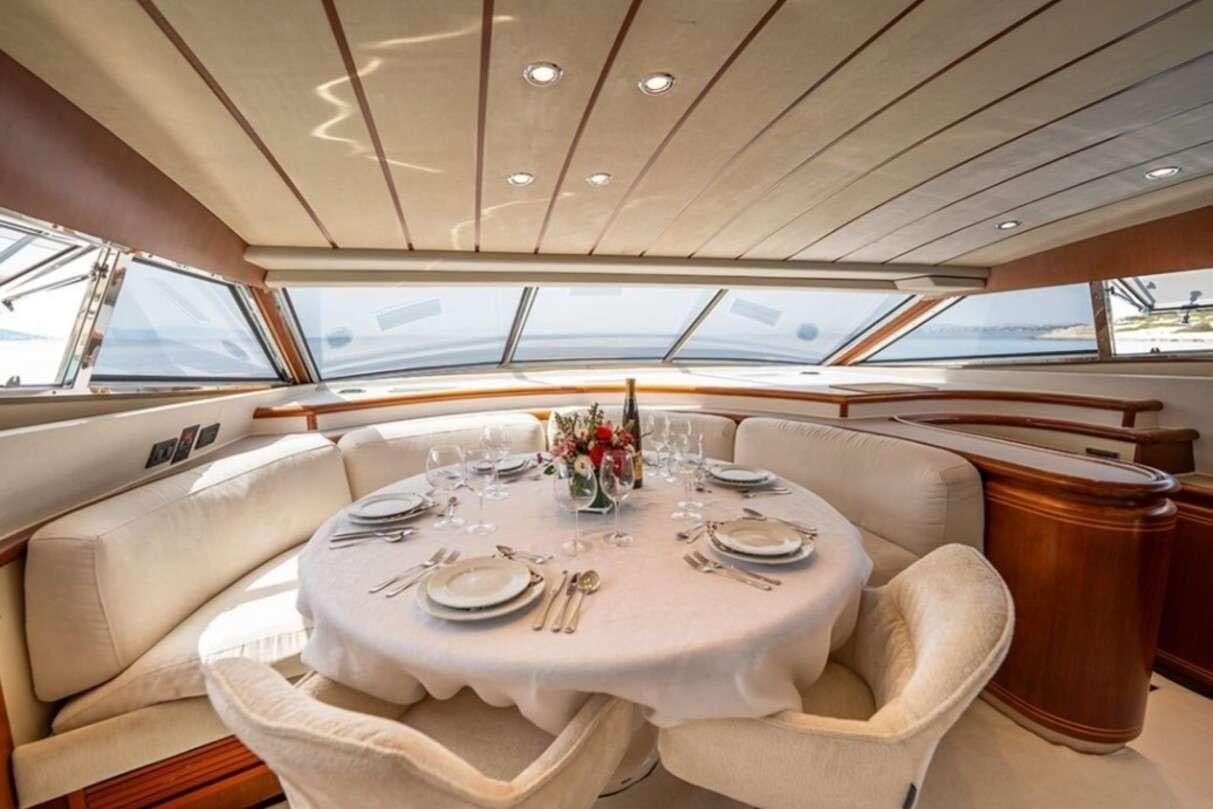 a dining table in a tent aboard BELLAS BOY Yacht for Charter