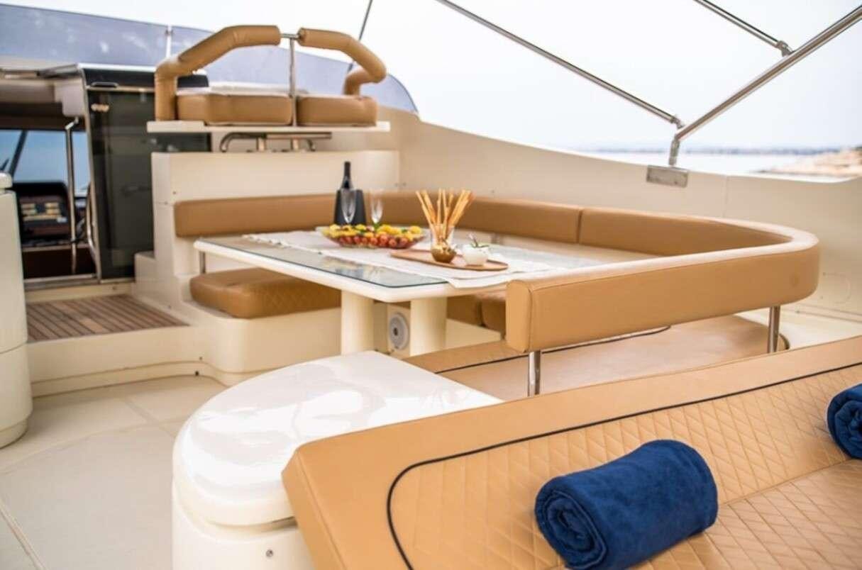 a room with a couch and a table aboard BELLAS BOY Yacht for Charter