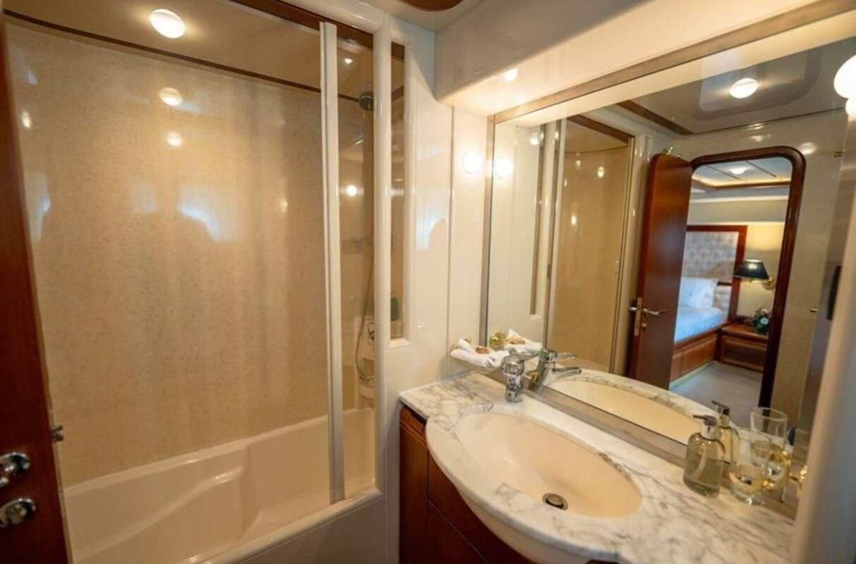 a bathroom with a large mirror aboard BELLAS BOY Yacht for Charter