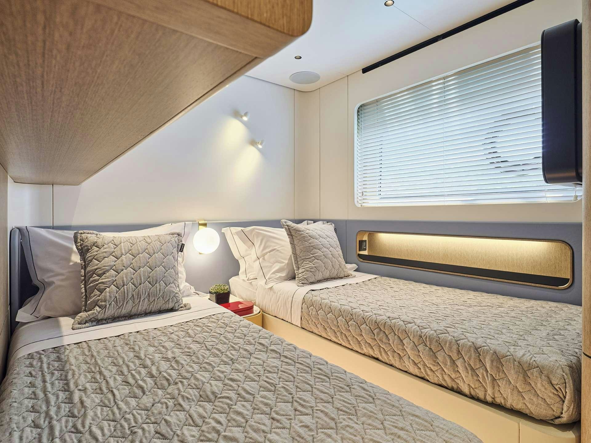 a couple of beds in a room aboard ALADDIN SANE Yacht for Charter
