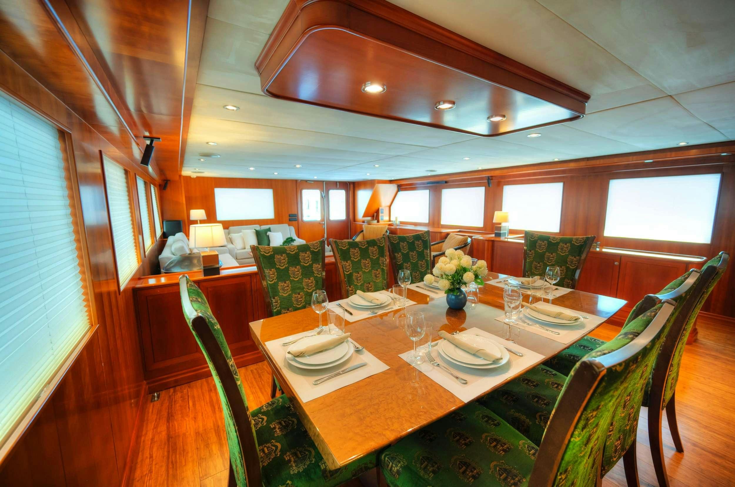 a dining room with a table set aboard VOYAGER Yacht for Charter
