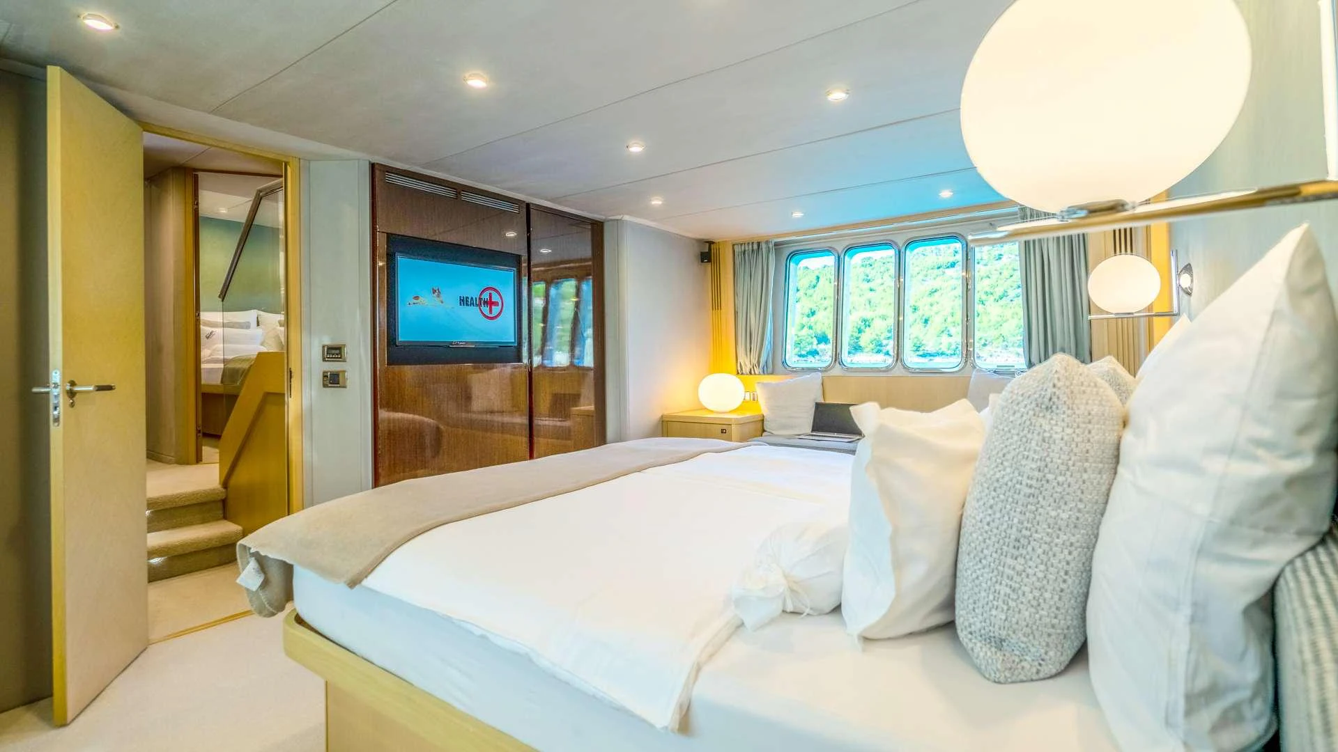 a bed with pillows and pillows aboard INSIEME Yacht for Charter