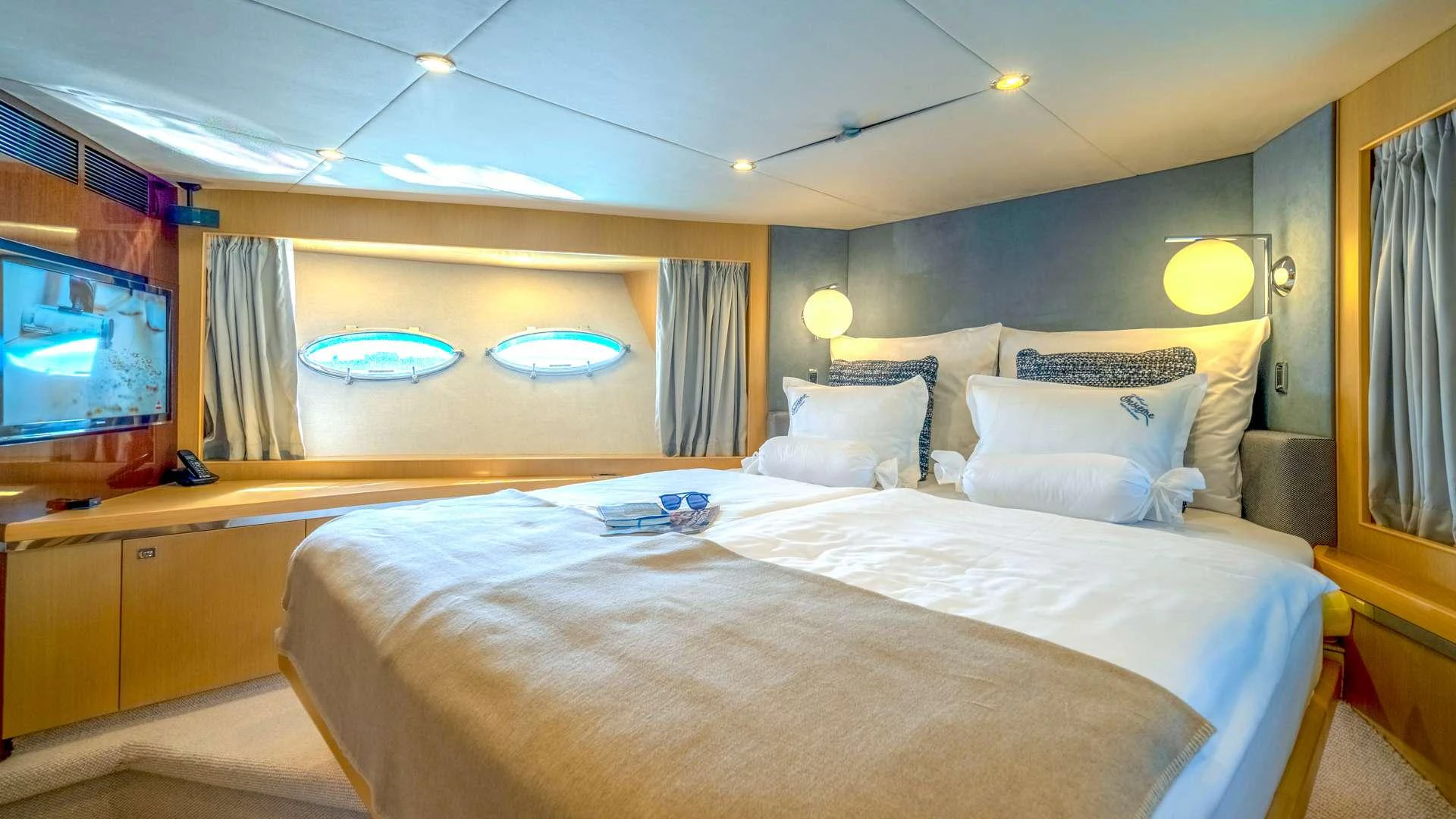 a bed in a room aboard INSIEME Yacht for Charter