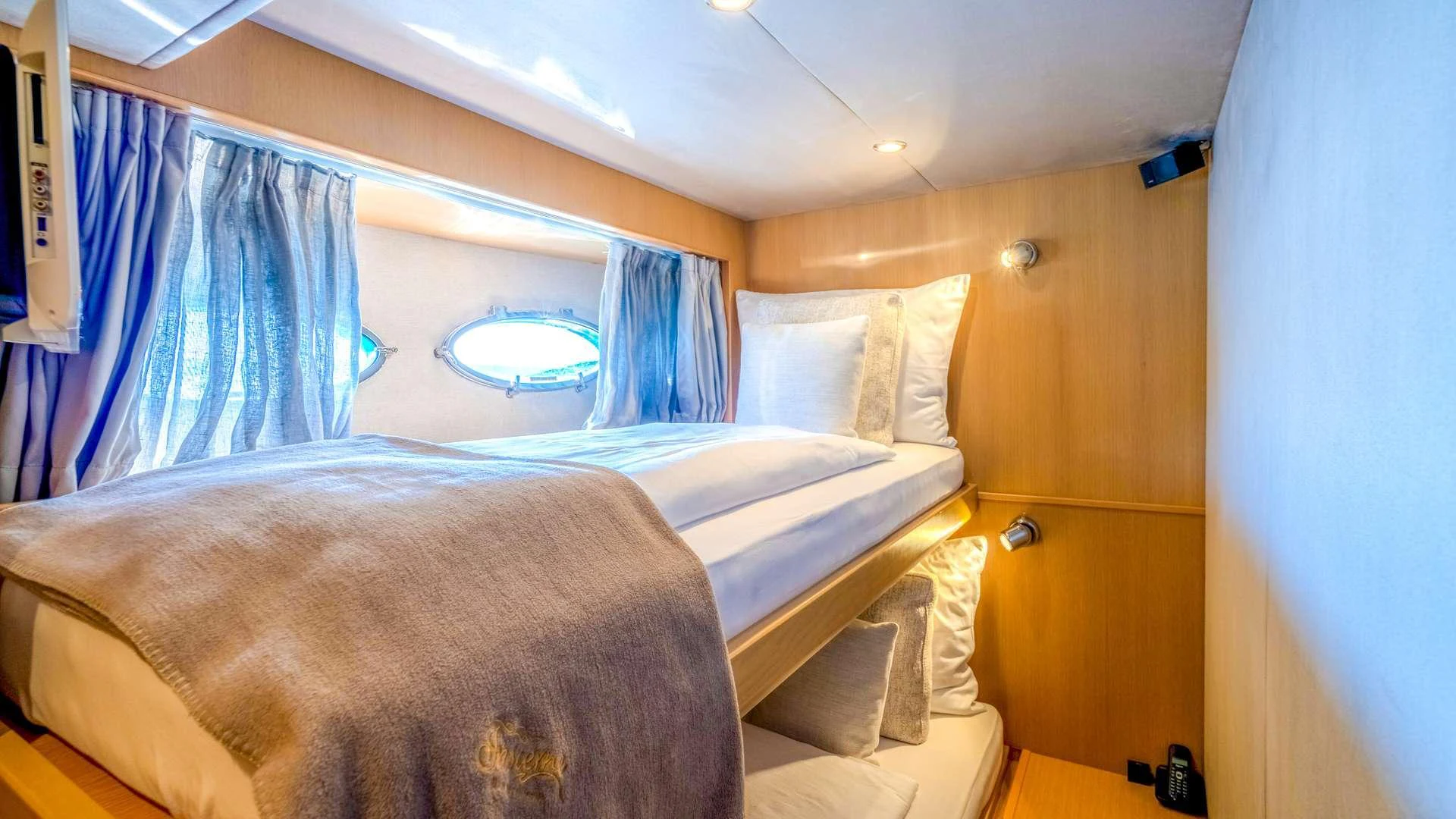 a room with two beds aboard INSIEME Yacht for Charter