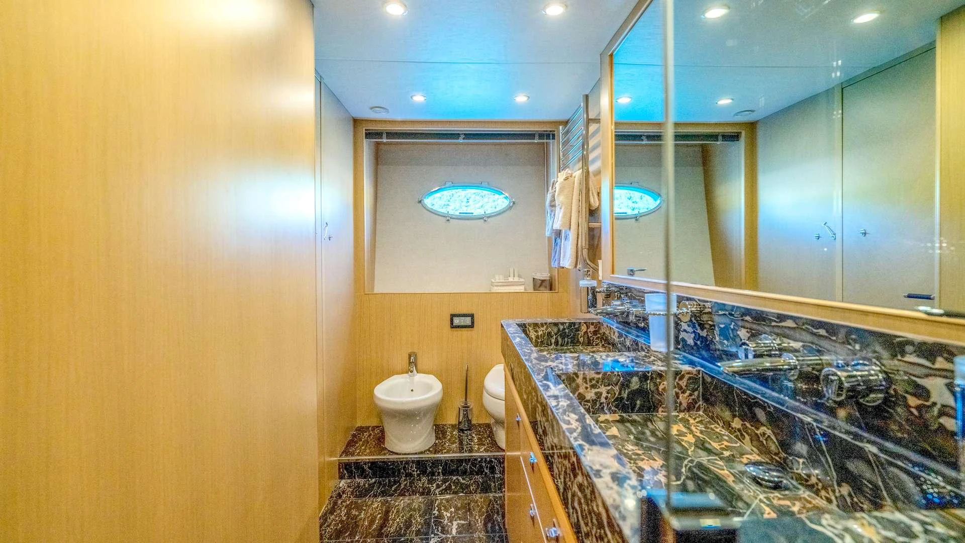 a bathroom with a glass shower aboard INSIEME Yacht for Charter