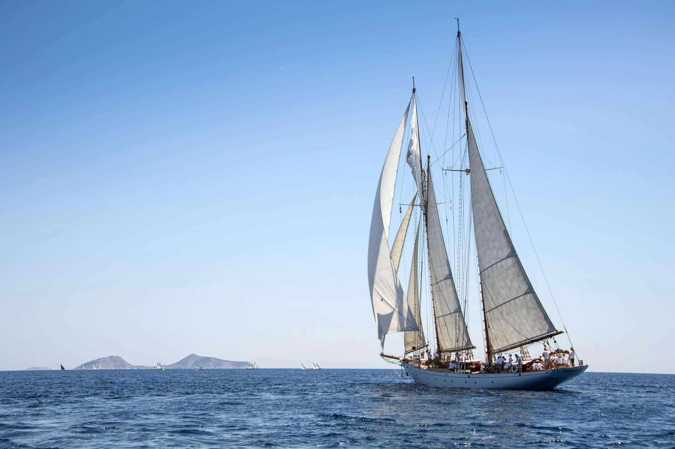 a sailboat on the water aboard PURITAN Yacht for Charter