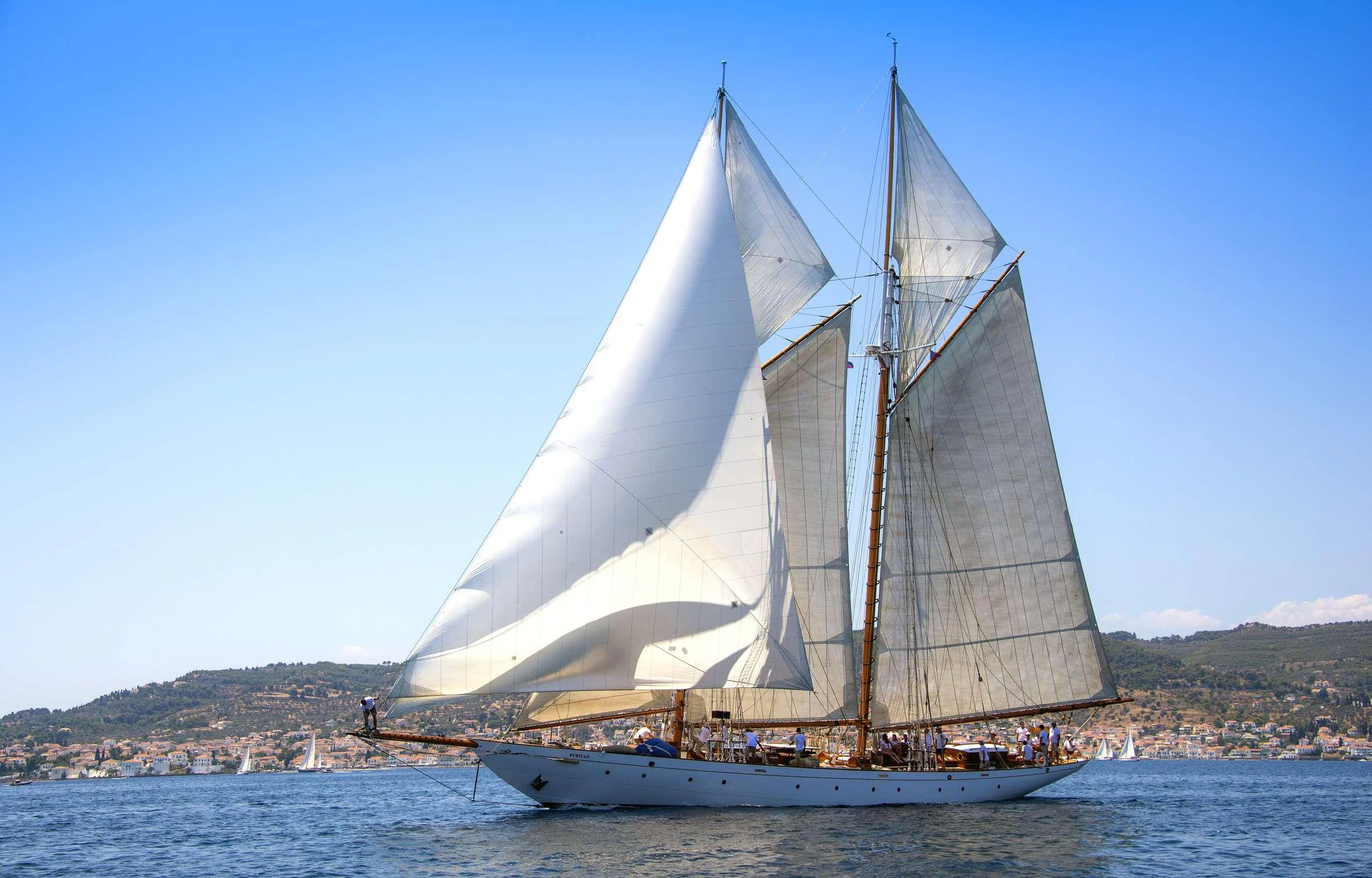 a sailboat on the water aboard PURITAN Yacht for Charter