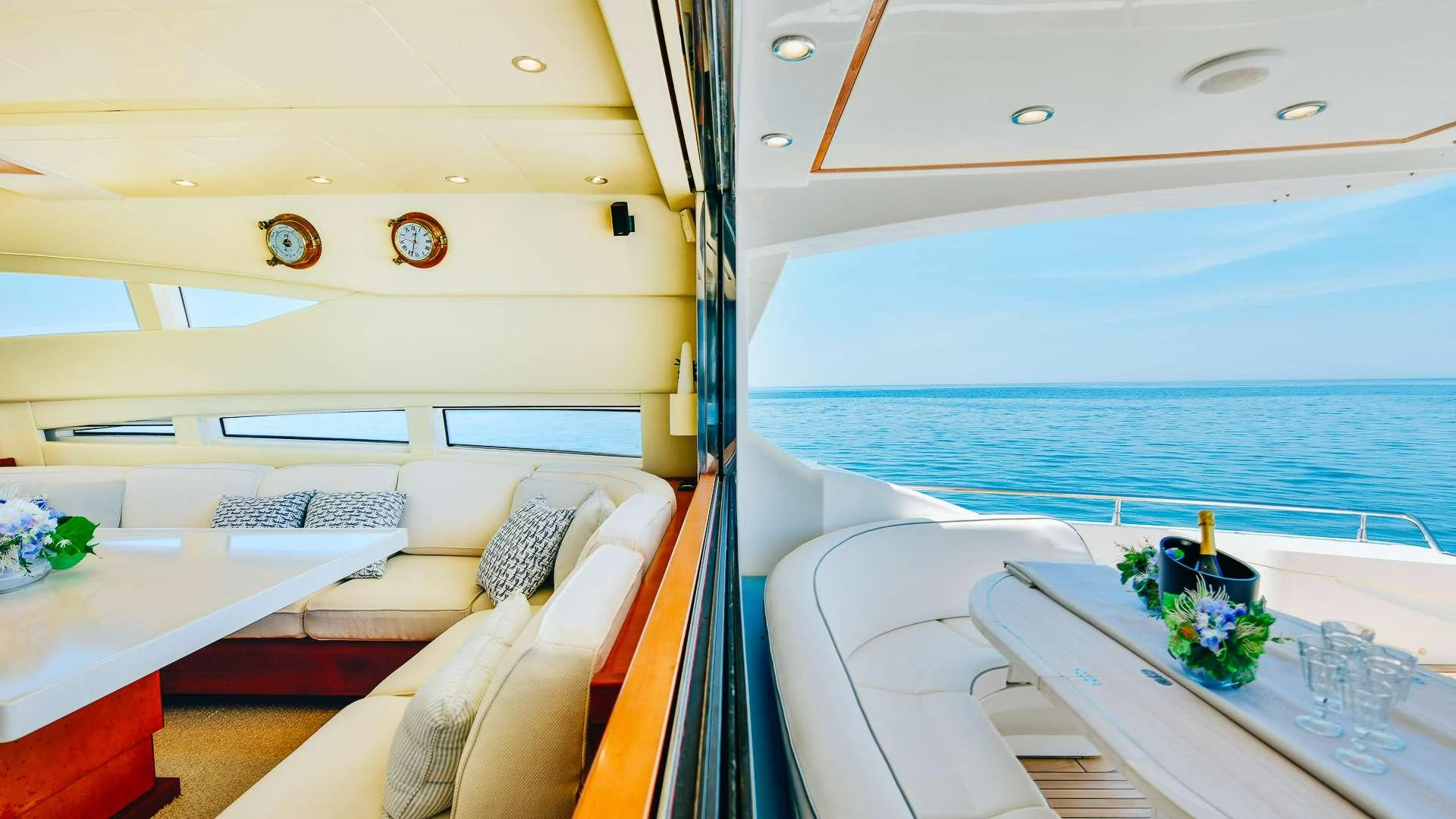 a boat with a bed and a table aboard CAMY Yacht for Charter