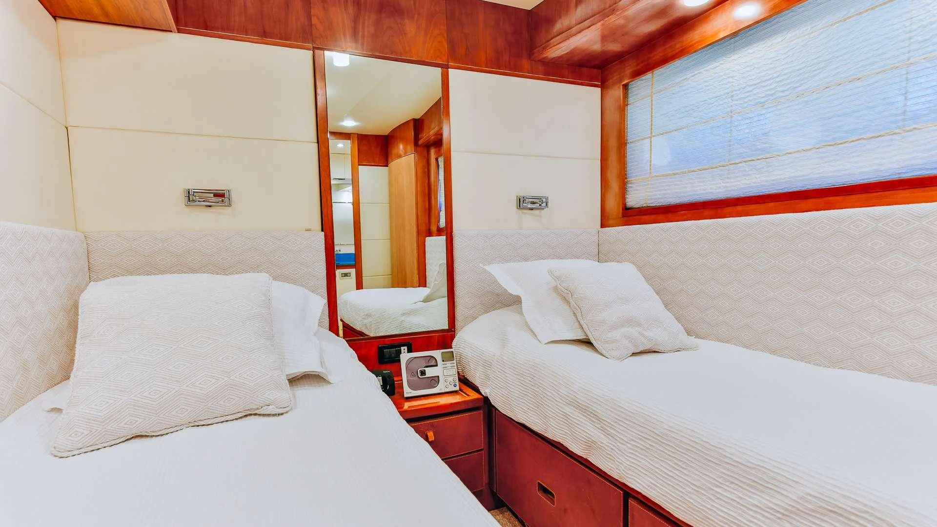a couple of beds in a room aboard CAMY Yacht for Charter