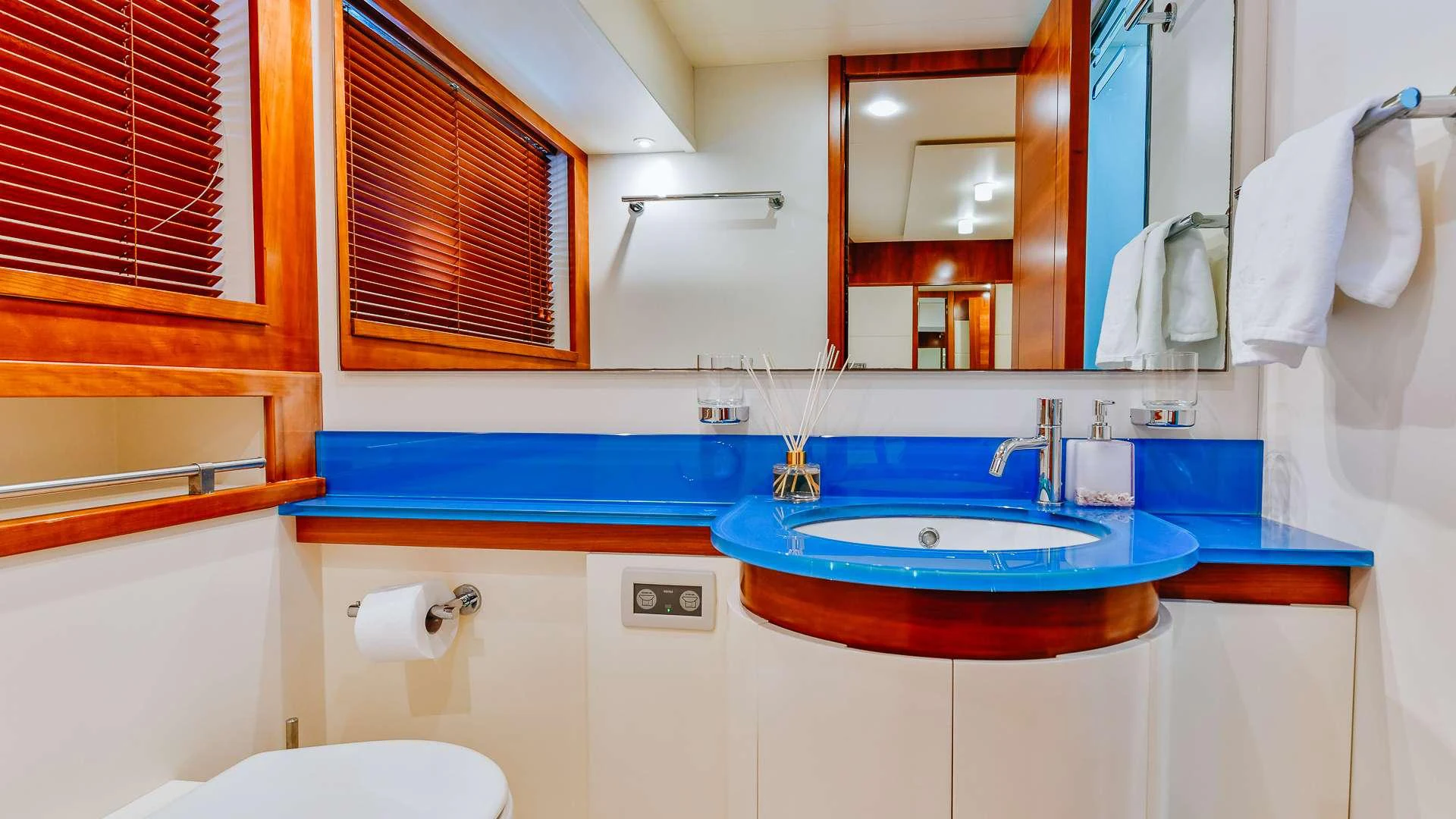 a bathroom with a sink and a mirror aboard CAMY Yacht for Charter