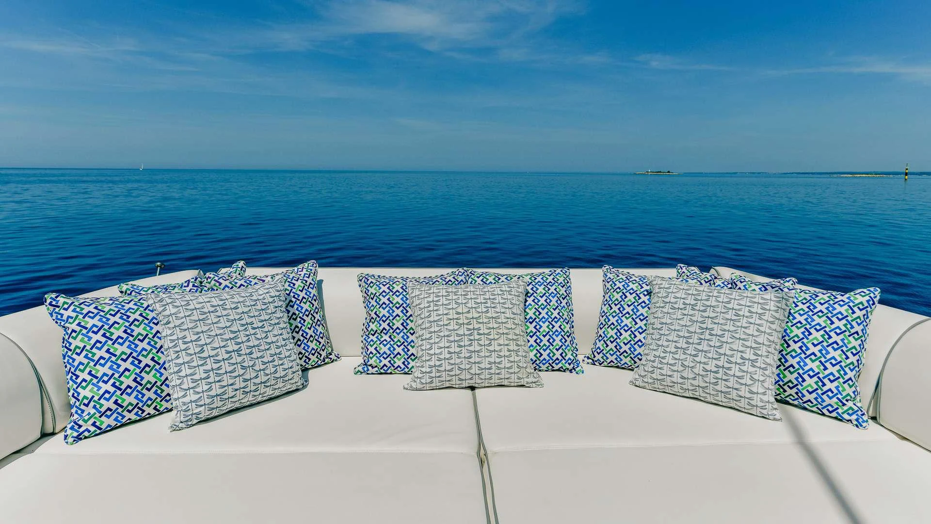 a group of pillows on a couch aboard CAMY Yacht for Charter