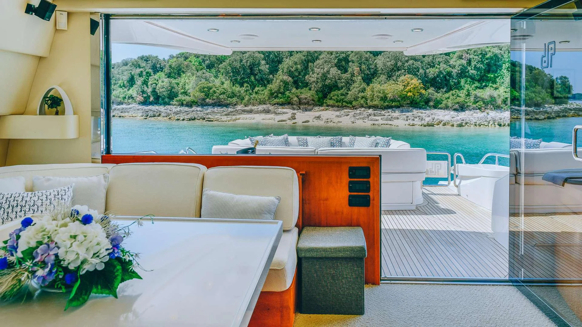 a room with a table and chairs aboard CAMY Yacht for Charter
