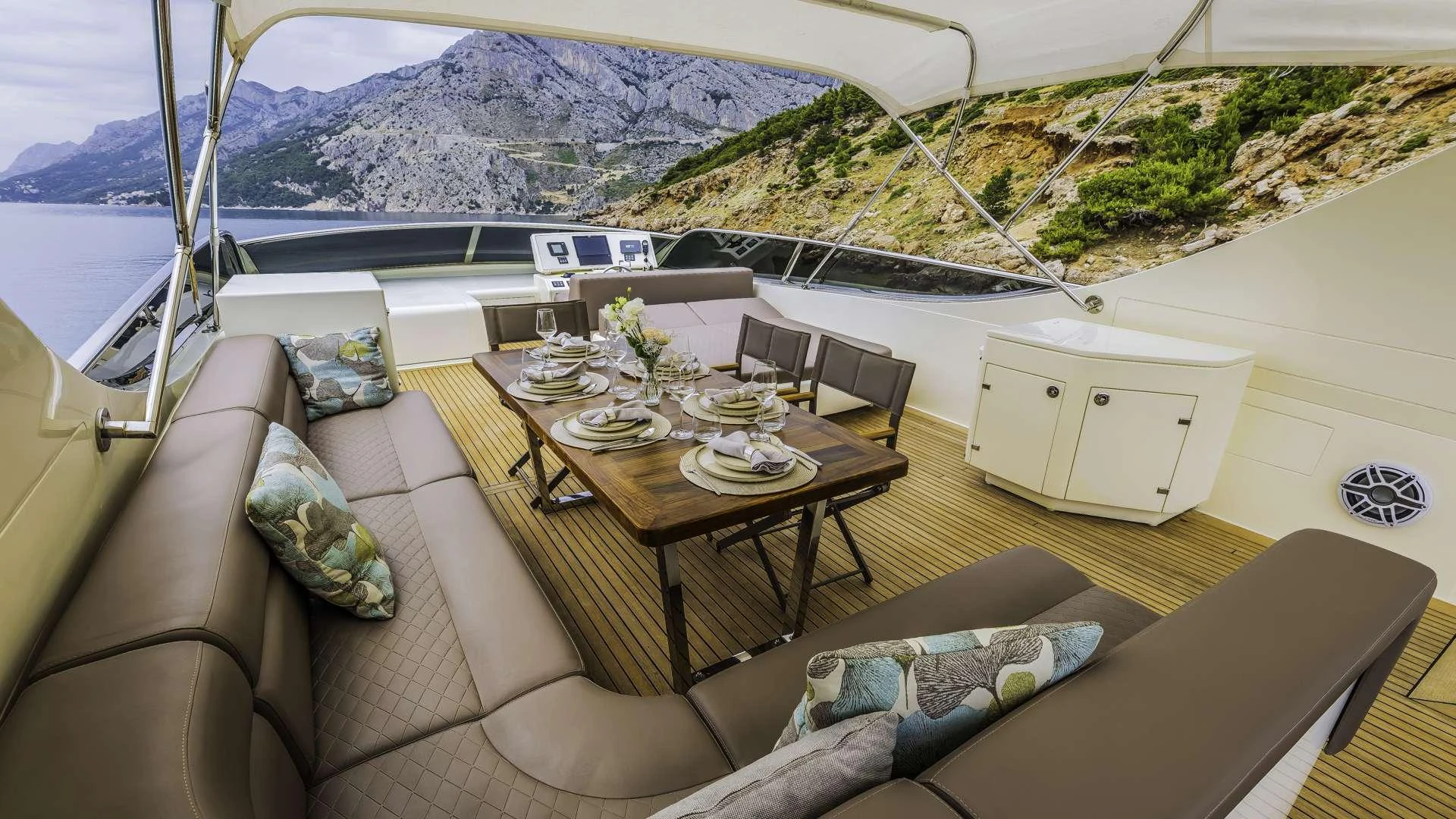 a room with a couch and a table and a bed aboard KARISMA Yacht for Charter