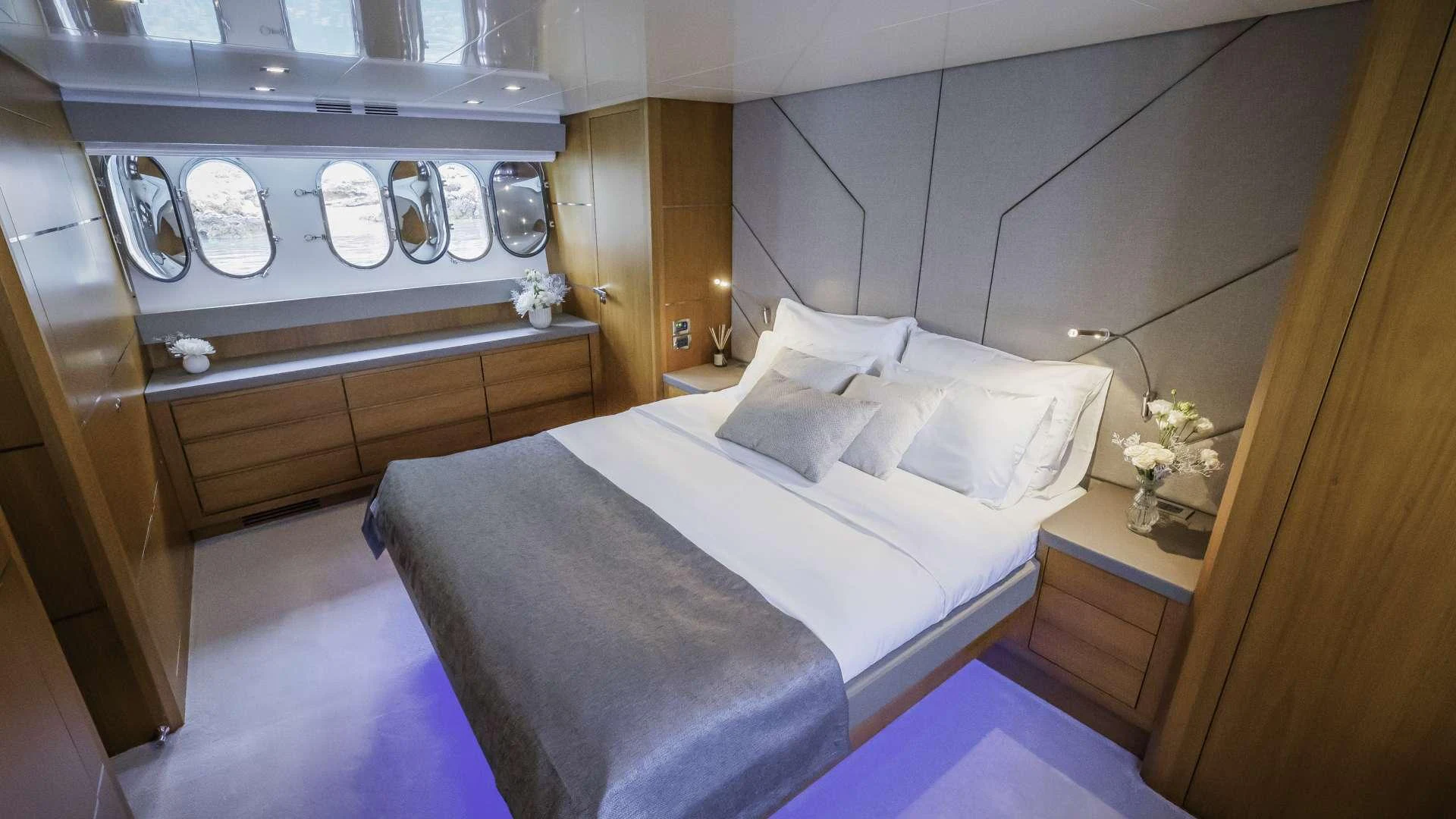 a room with a bed and a counter aboard KARISMA Yacht for Charter