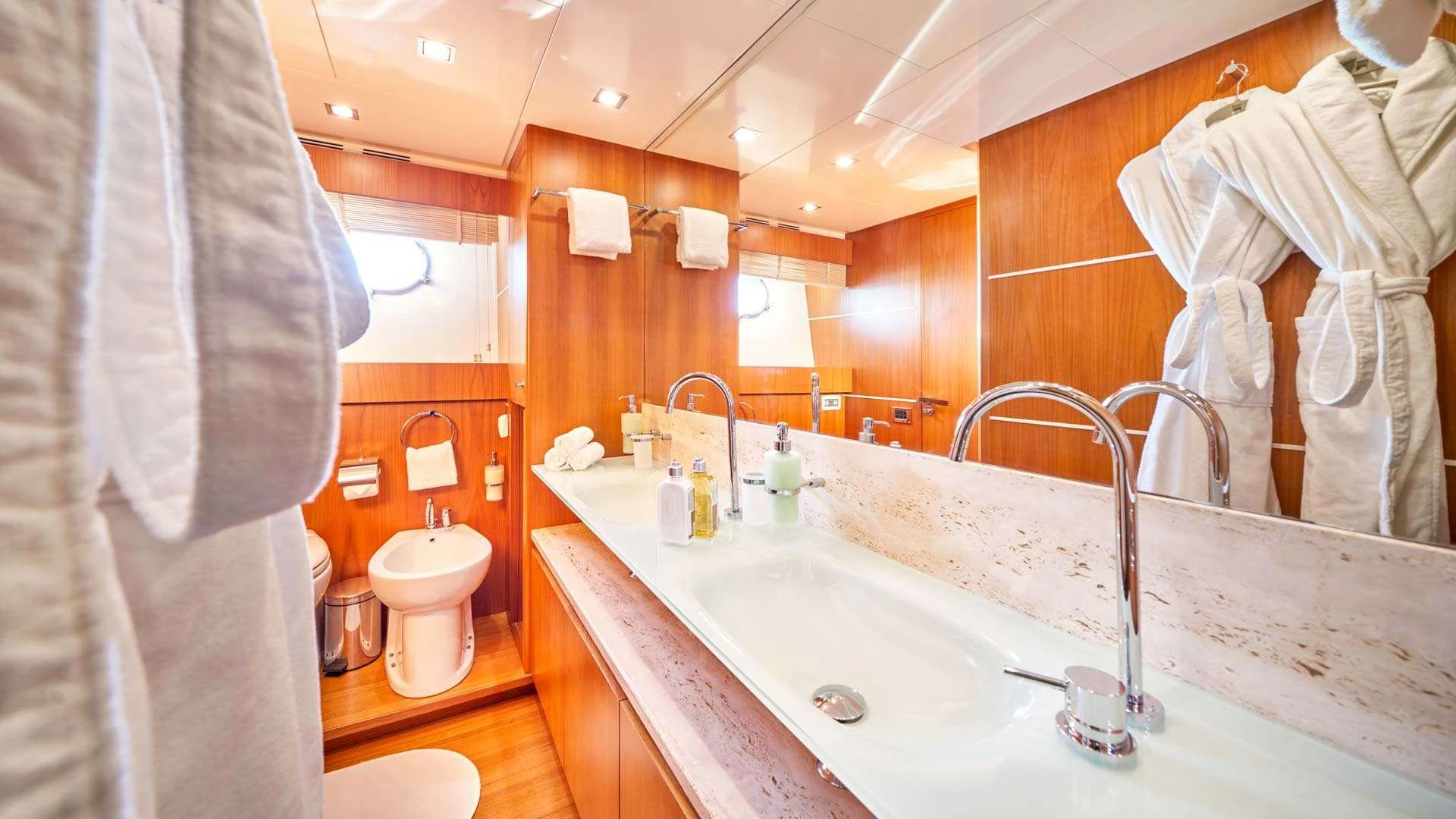 a bathroom with a sink and a toilet aboard KARISMA Yacht for Charter