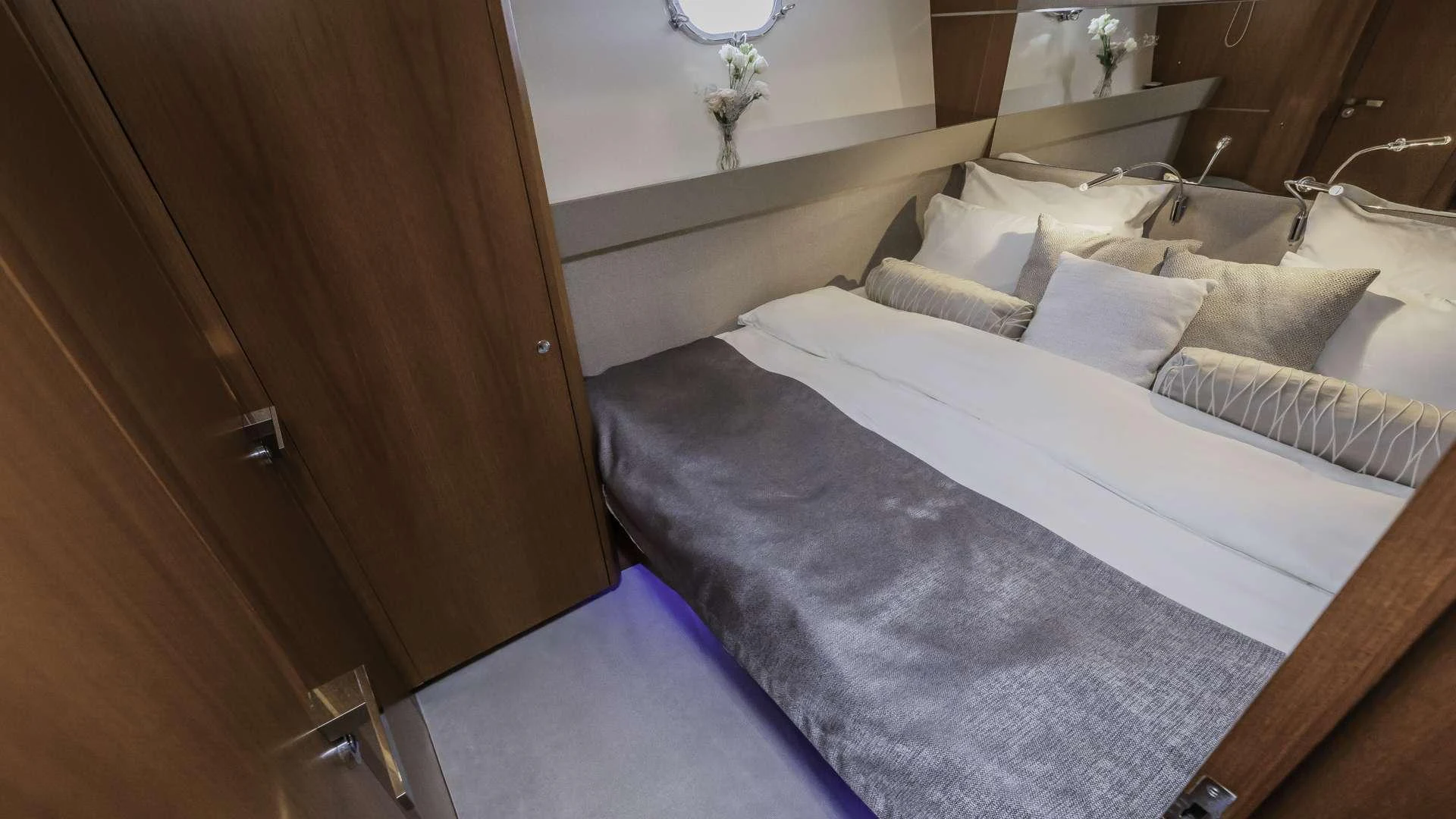 a bed with white sheets aboard KARISMA Yacht for Charter