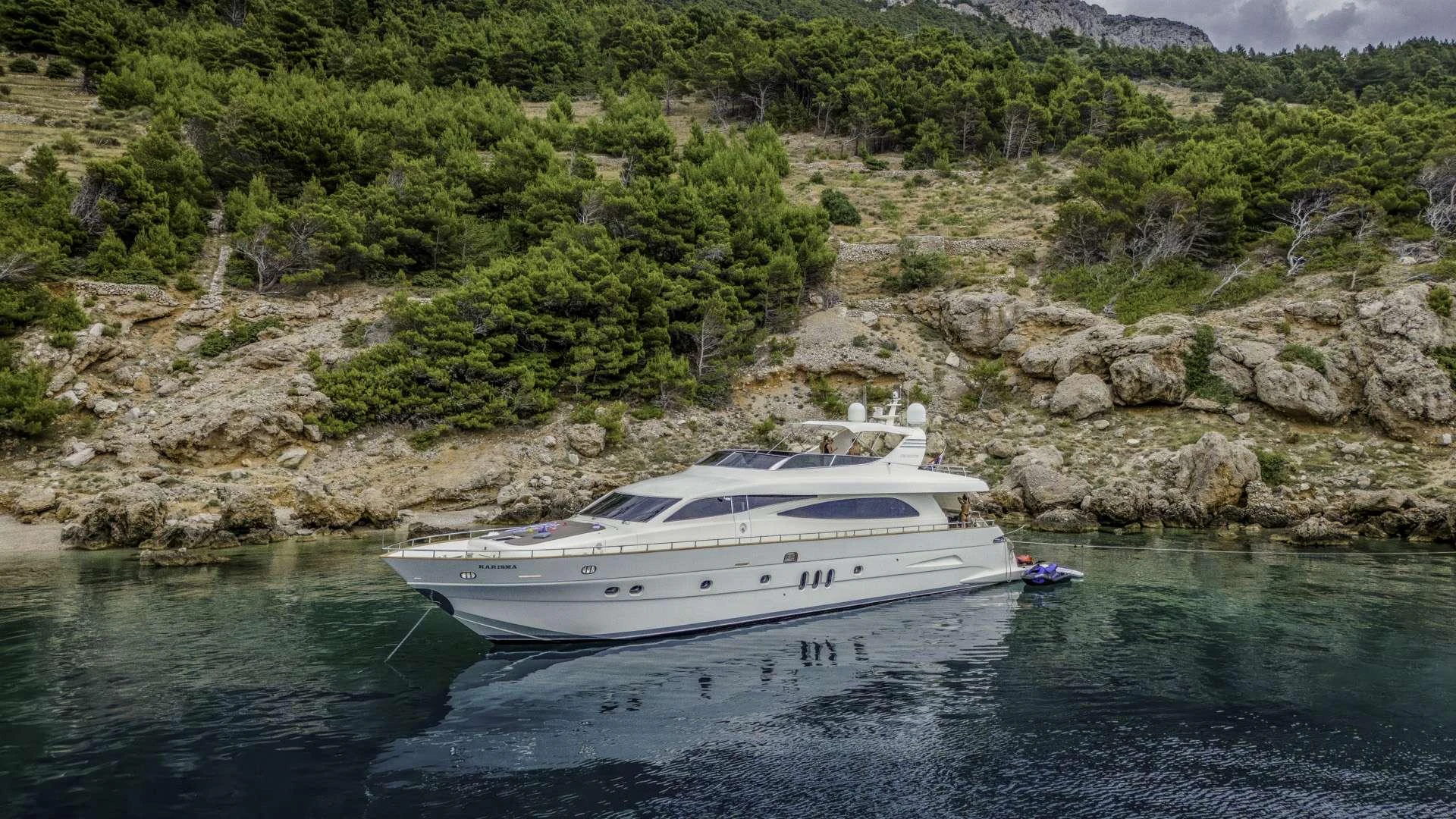 a white yacht in the water aboard KARISMA Yacht for Charter