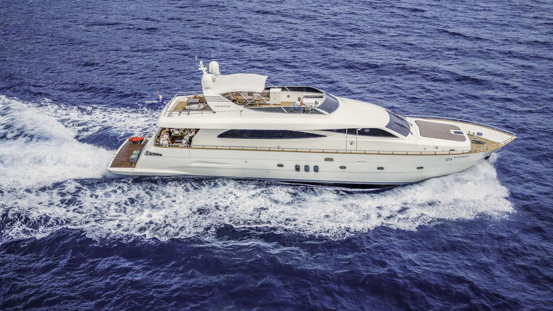 a white yacht on the water aboard KARISMA Yacht for Charter
