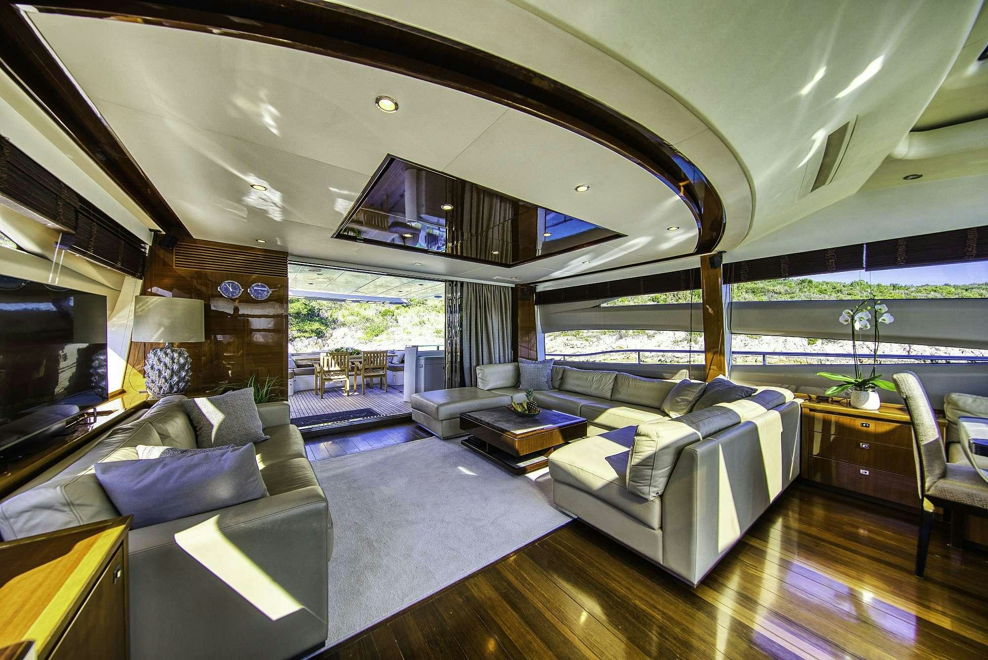 a room with a bed and a couch aboard AGAVE Yacht for Charter